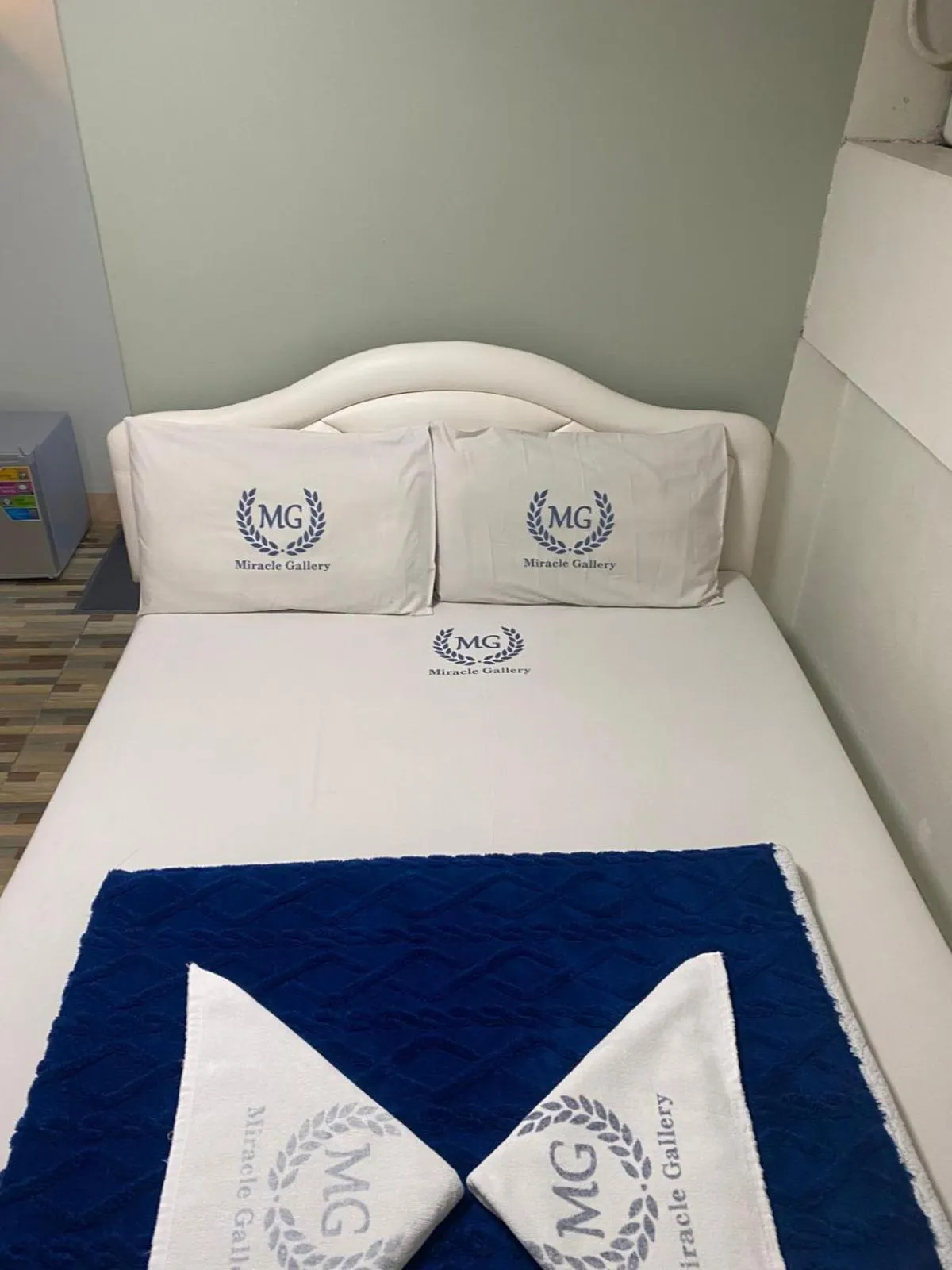 Bed in Miracle Gallery Hotel