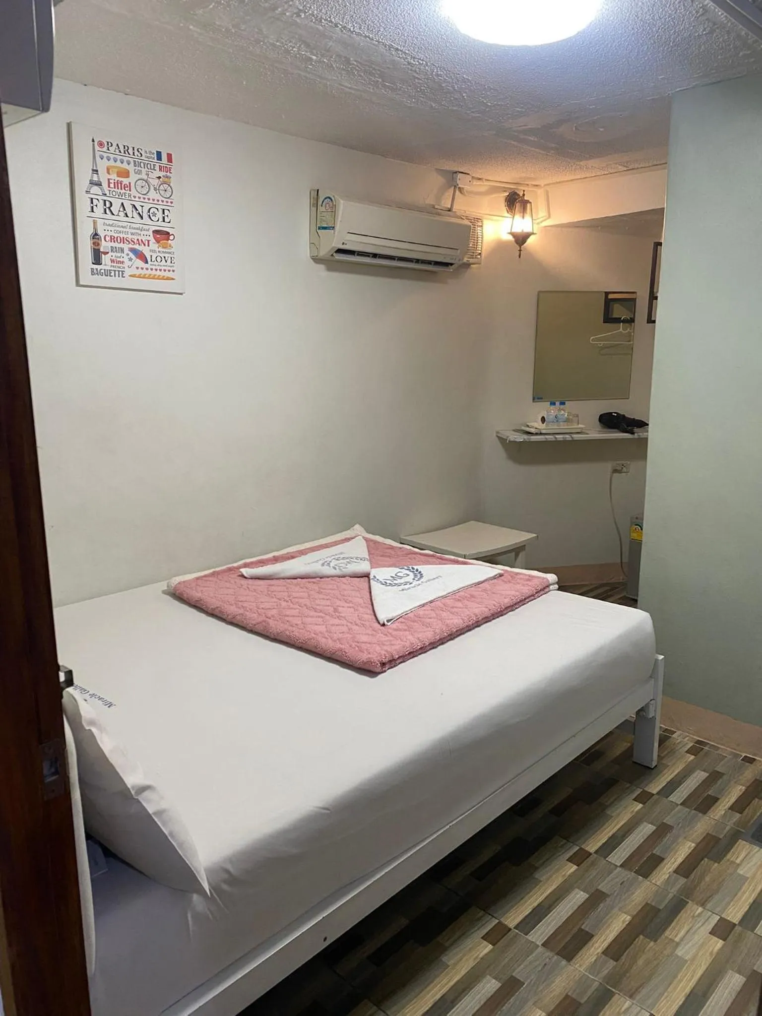 Bed in Miracle Gallery Hotel