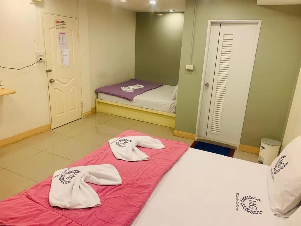 Bed in Miracle Gallery Hotel