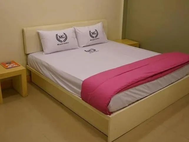 Bed in Miracle Gallery Hotel
