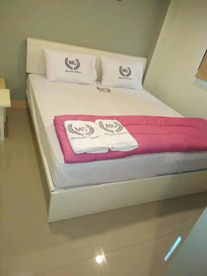 Bed in Miracle Gallery Hotel