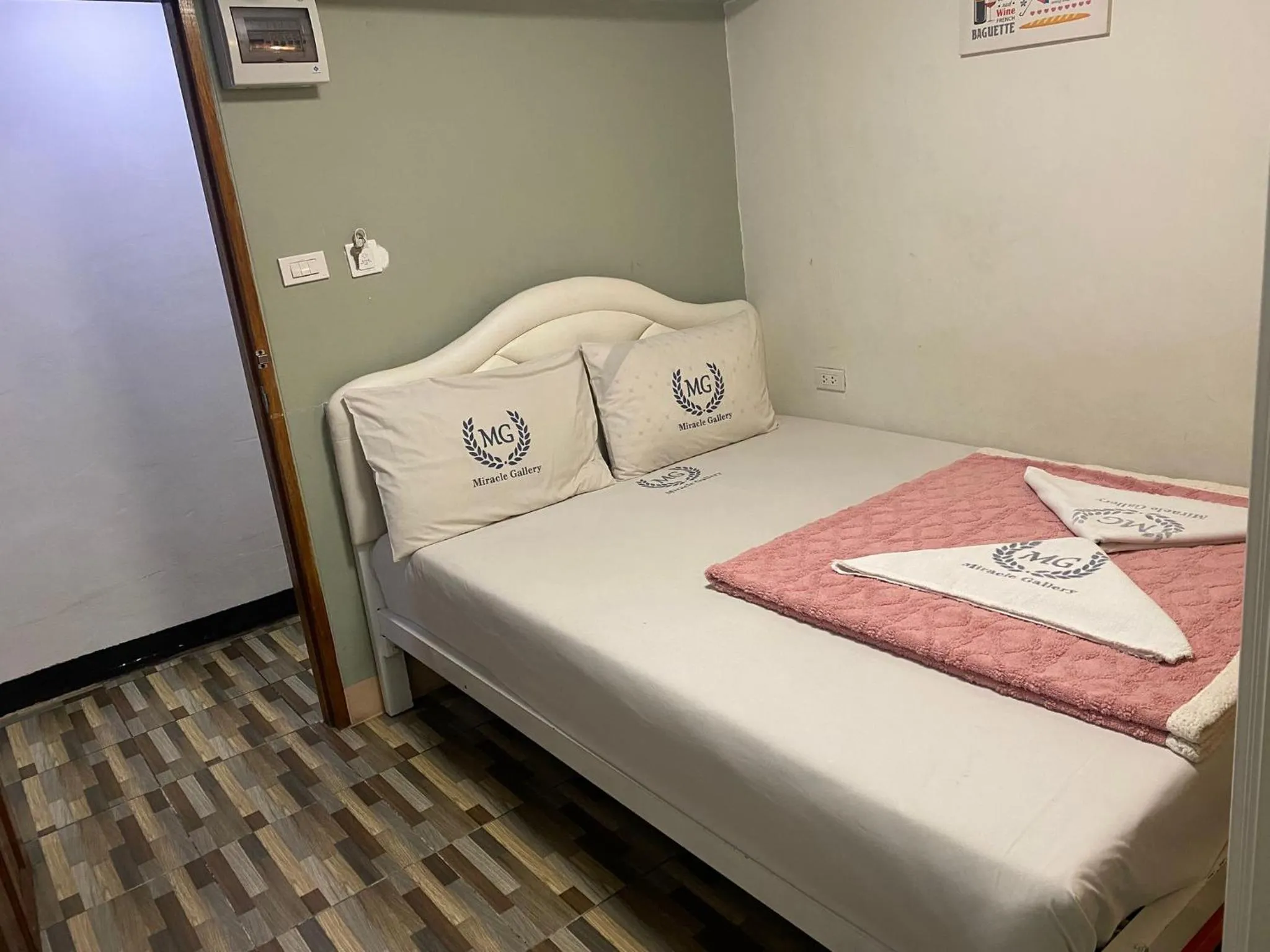 Bed in Miracle Gallery Hotel