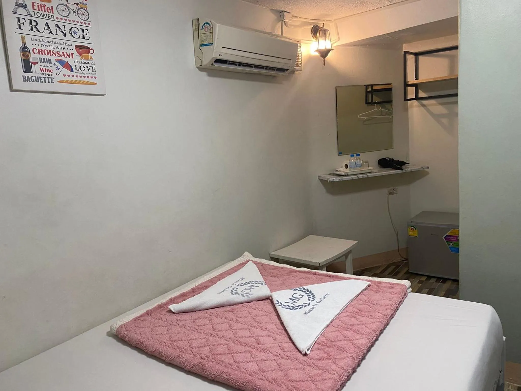 Bed in Miracle Gallery Hotel