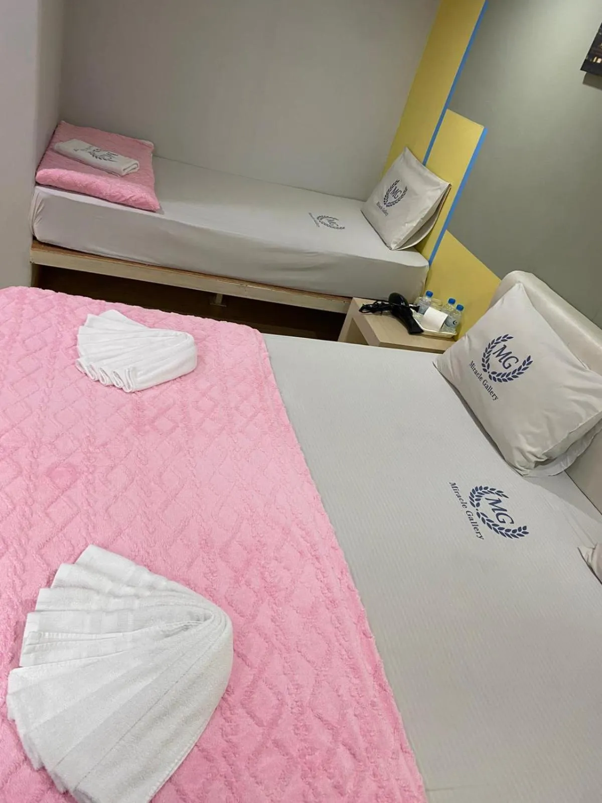 Bed in Miracle Gallery Hotel