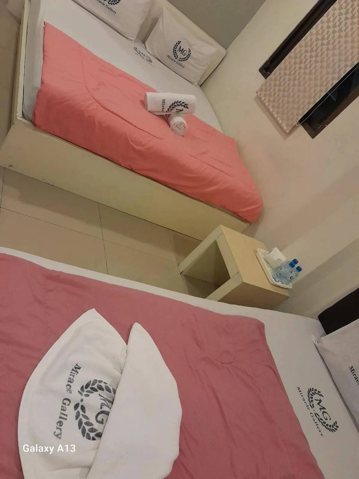 Bed in Miracle Gallery Hotel