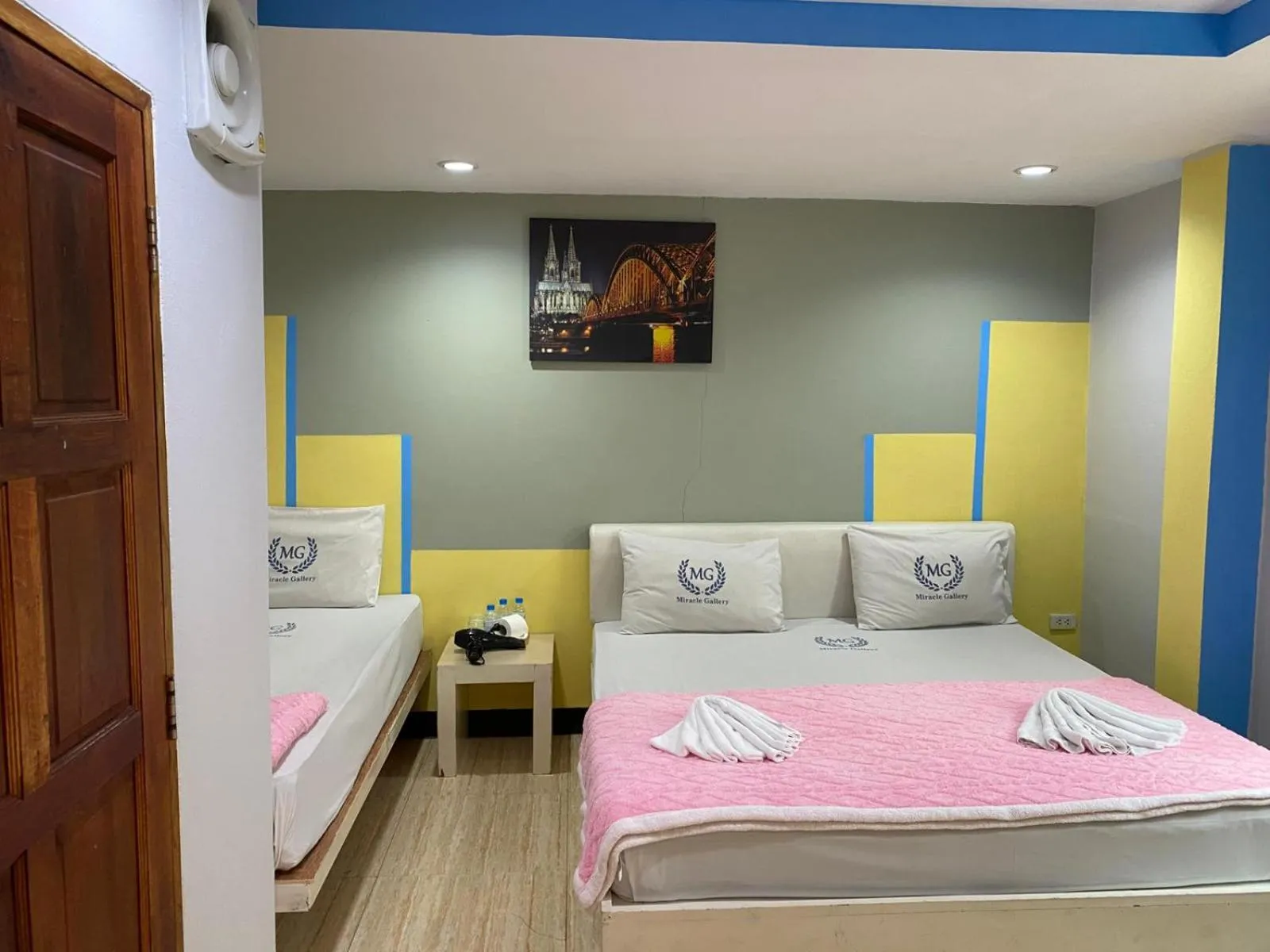 Bed in Miracle Gallery Hotel