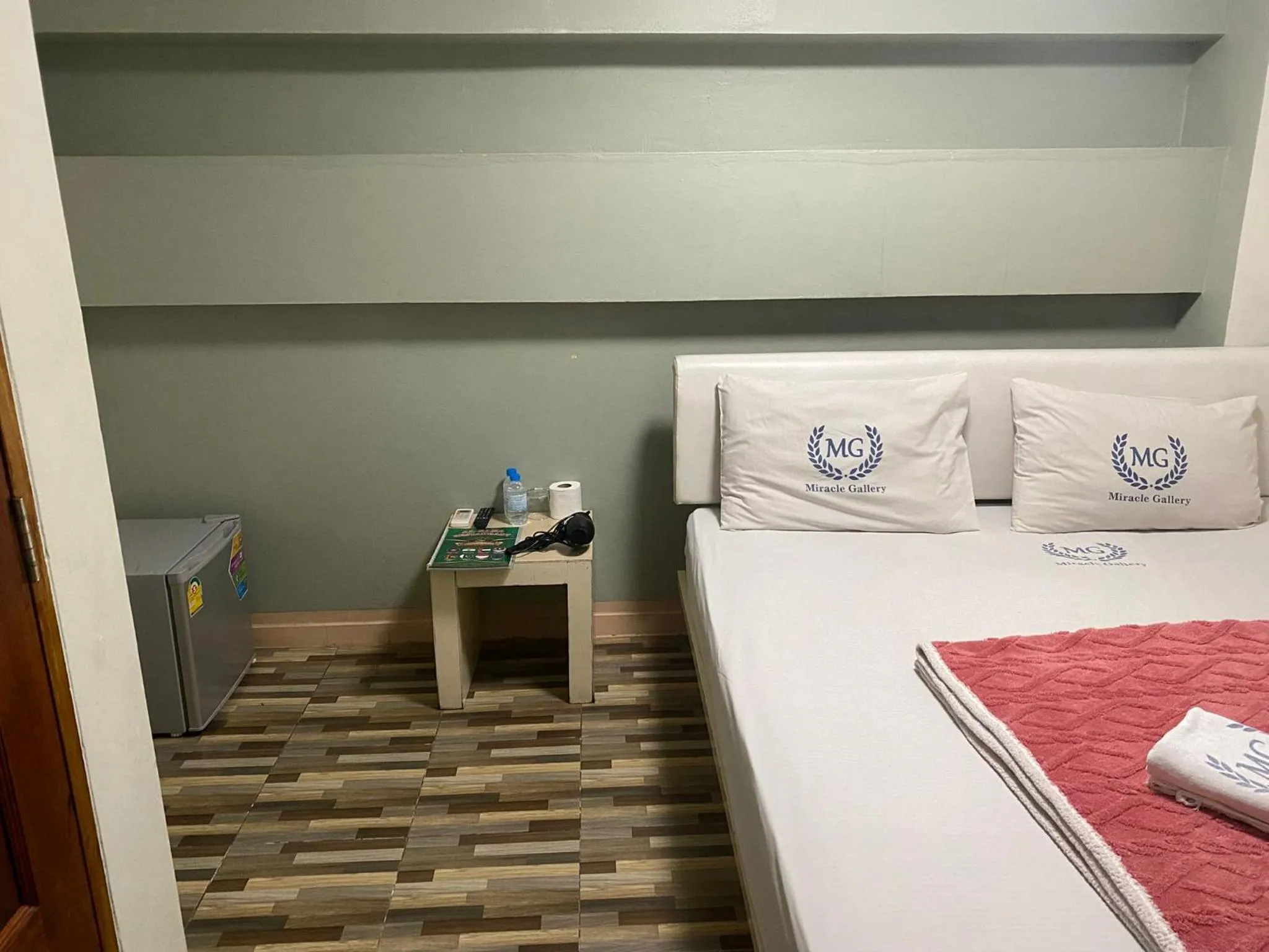 Bed in Miracle Gallery Hotel