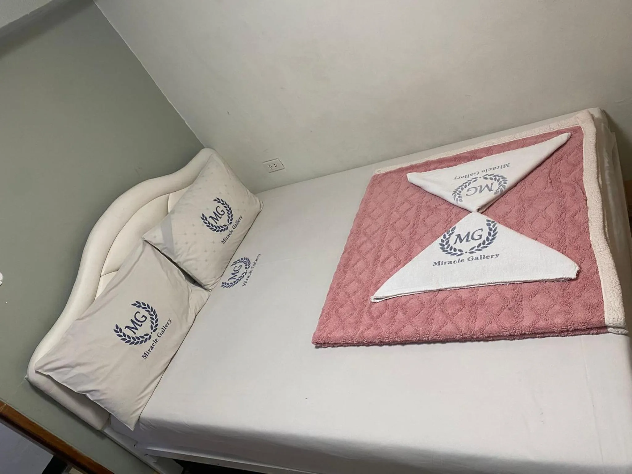 Bed in Miracle Gallery Hotel