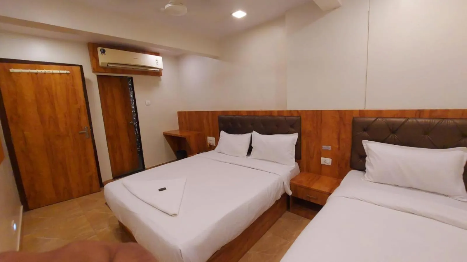 Photo of the whole room, Bed in HOTEL RIGGA INN KOKILABEN DHIRUBHAI AMBANI Hospital