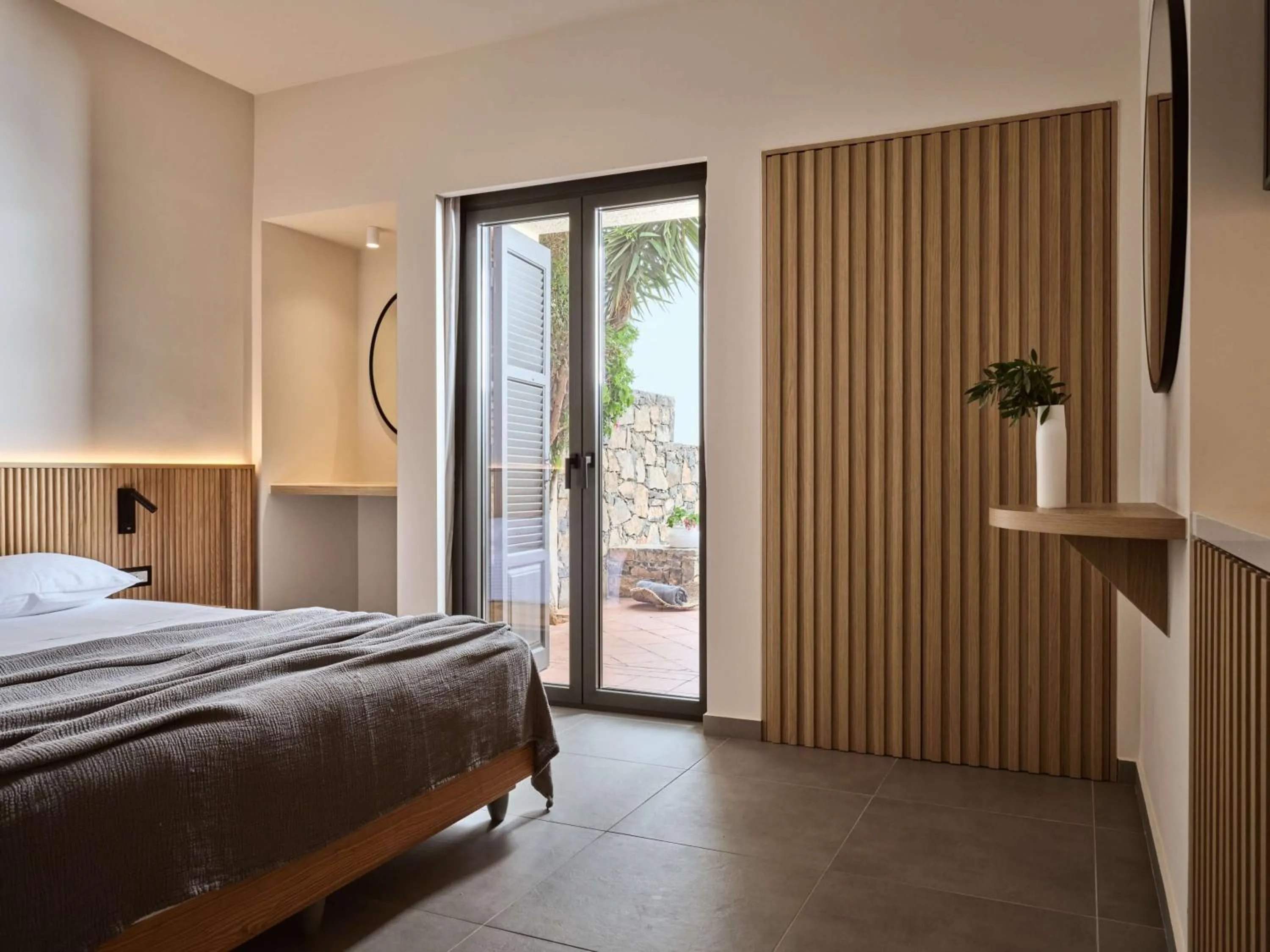 Bed in Elounda Palm Hotel & Suites