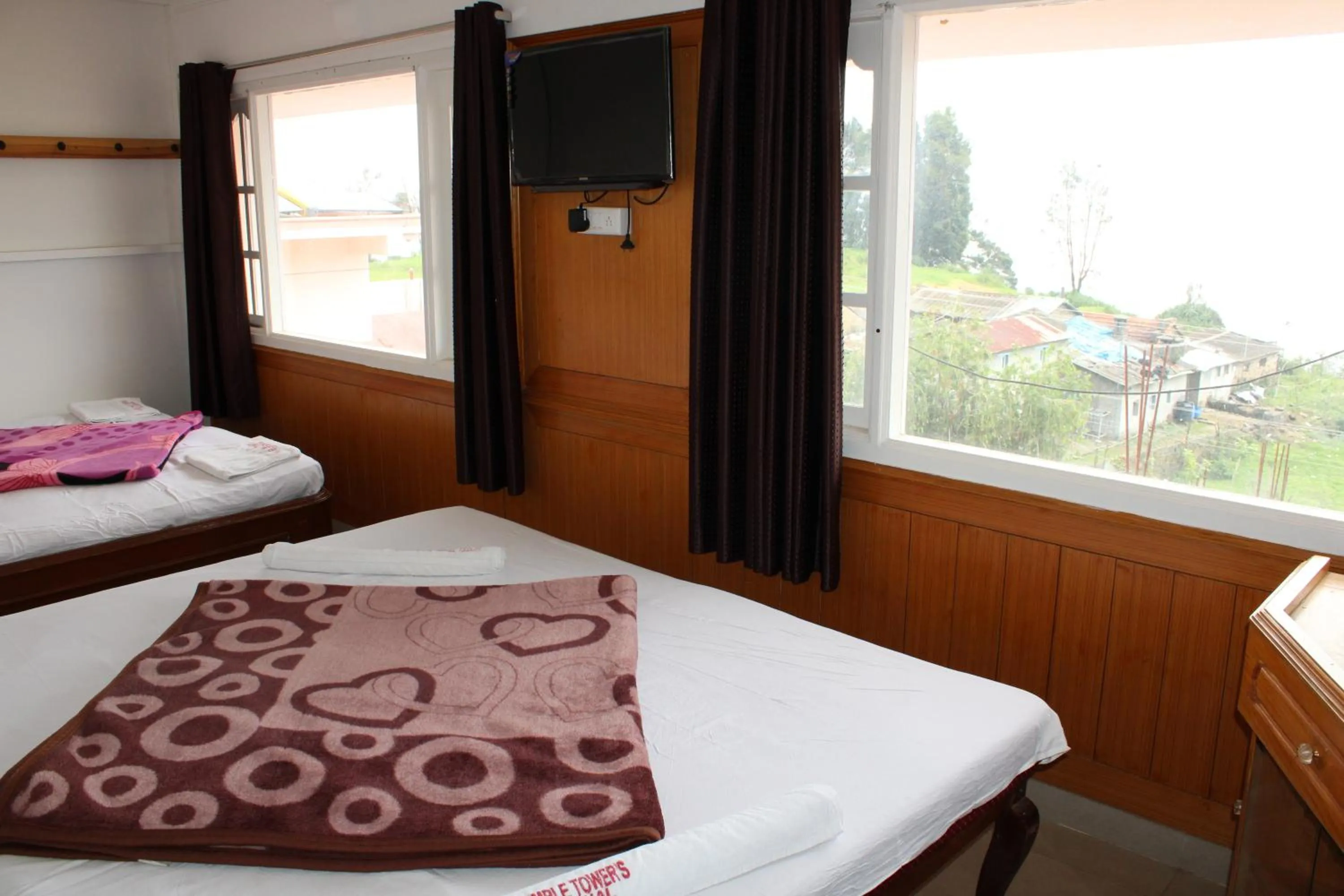 Bed in Hotel Temple Towers