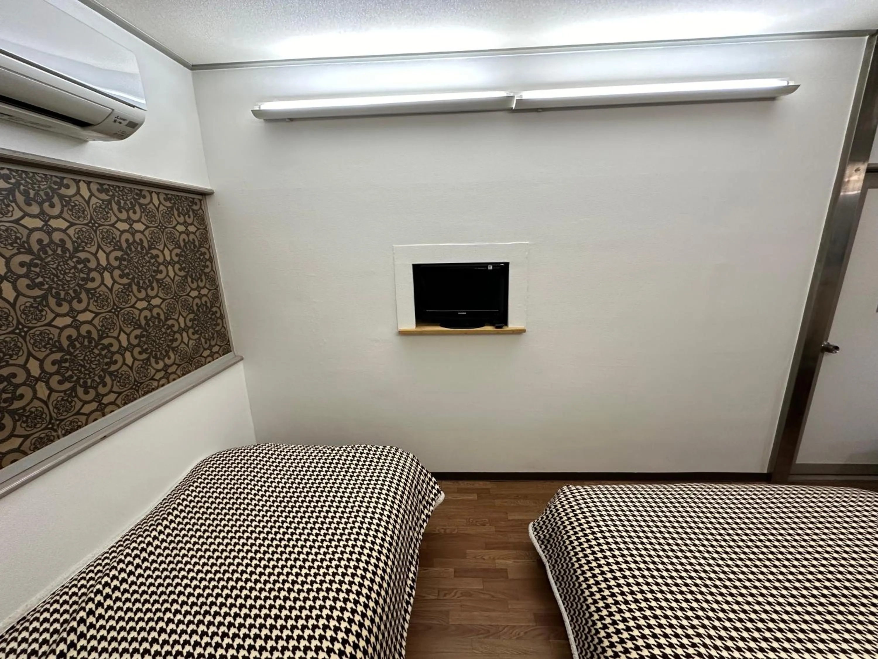 Bed in Hotel Rakusai