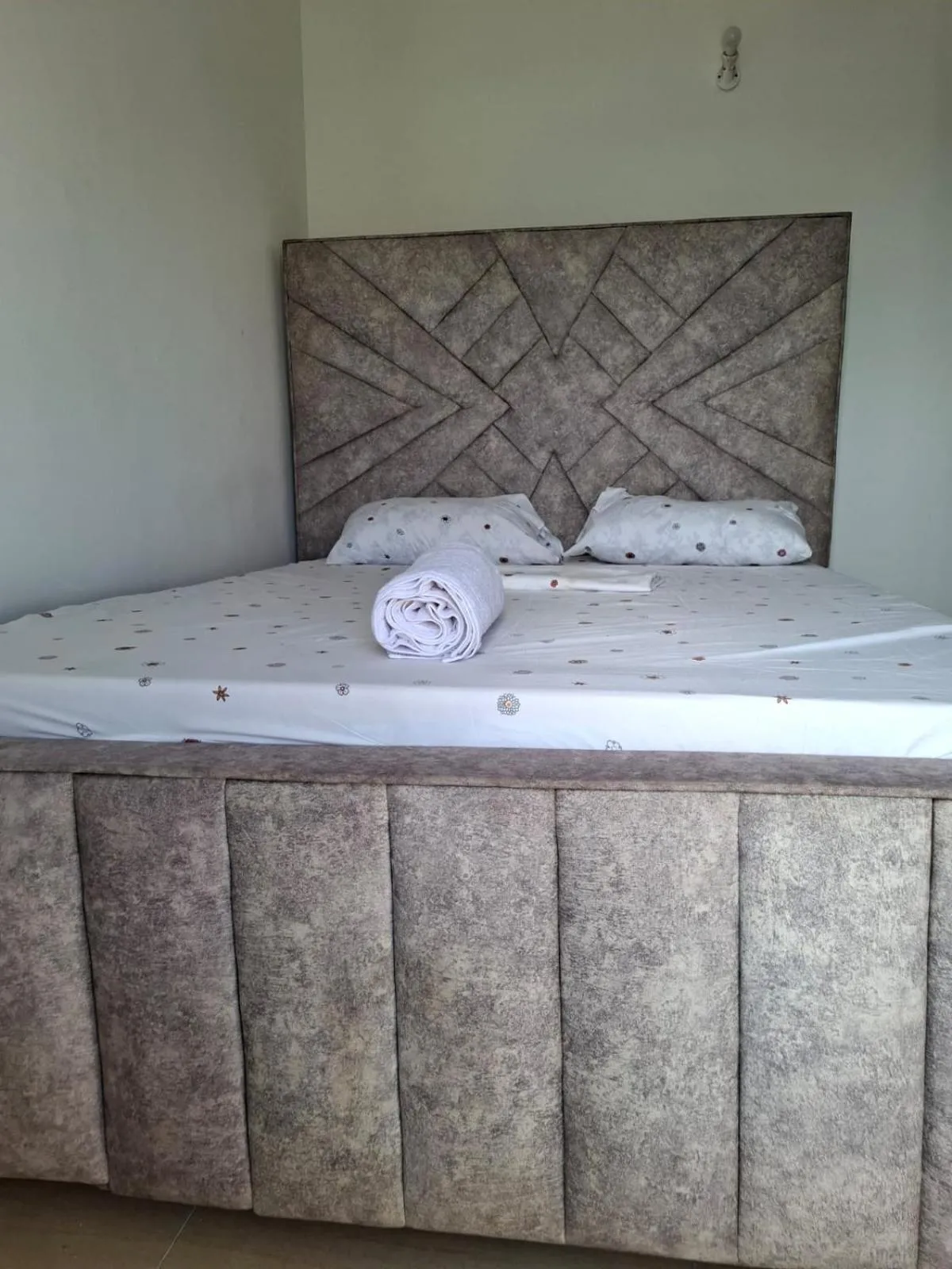Bed in Royal Studio Apartment