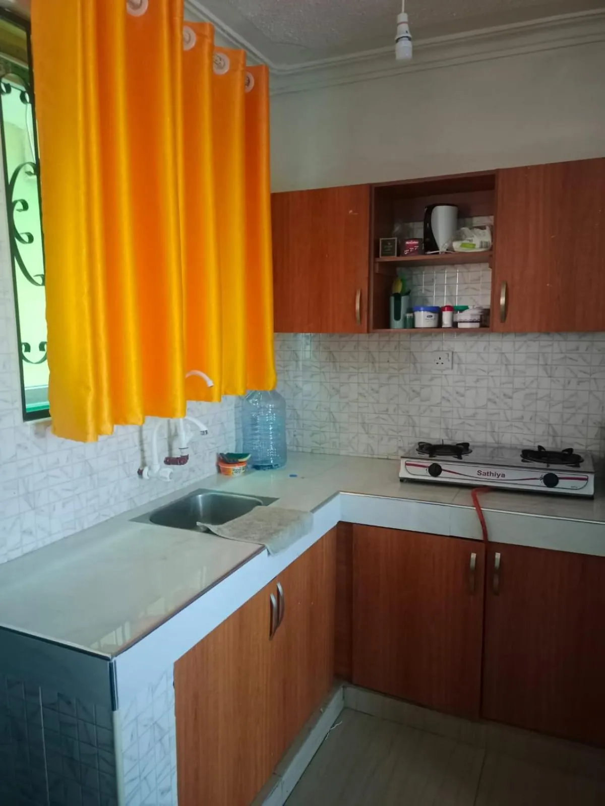 Kitchen or kitchenette in Royal Studio Apartment