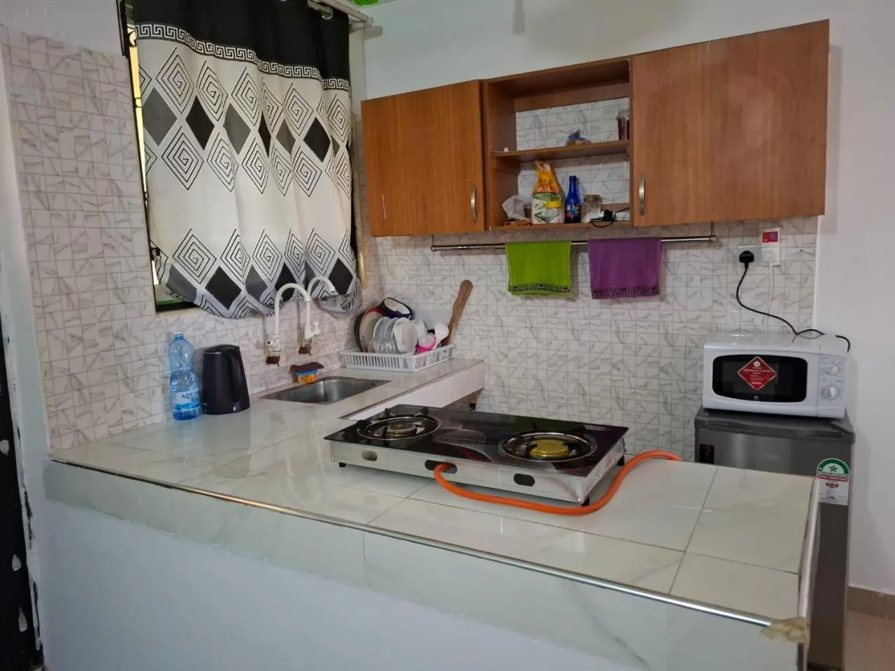 Kitchen or kitchenette in Royal Studio Apartment