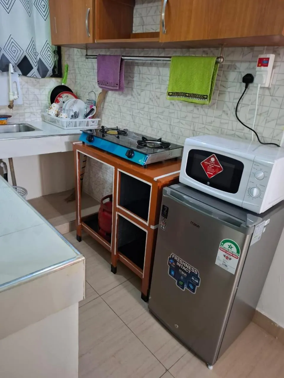 Kitchen or kitchenette in Royal Studio Apartment
