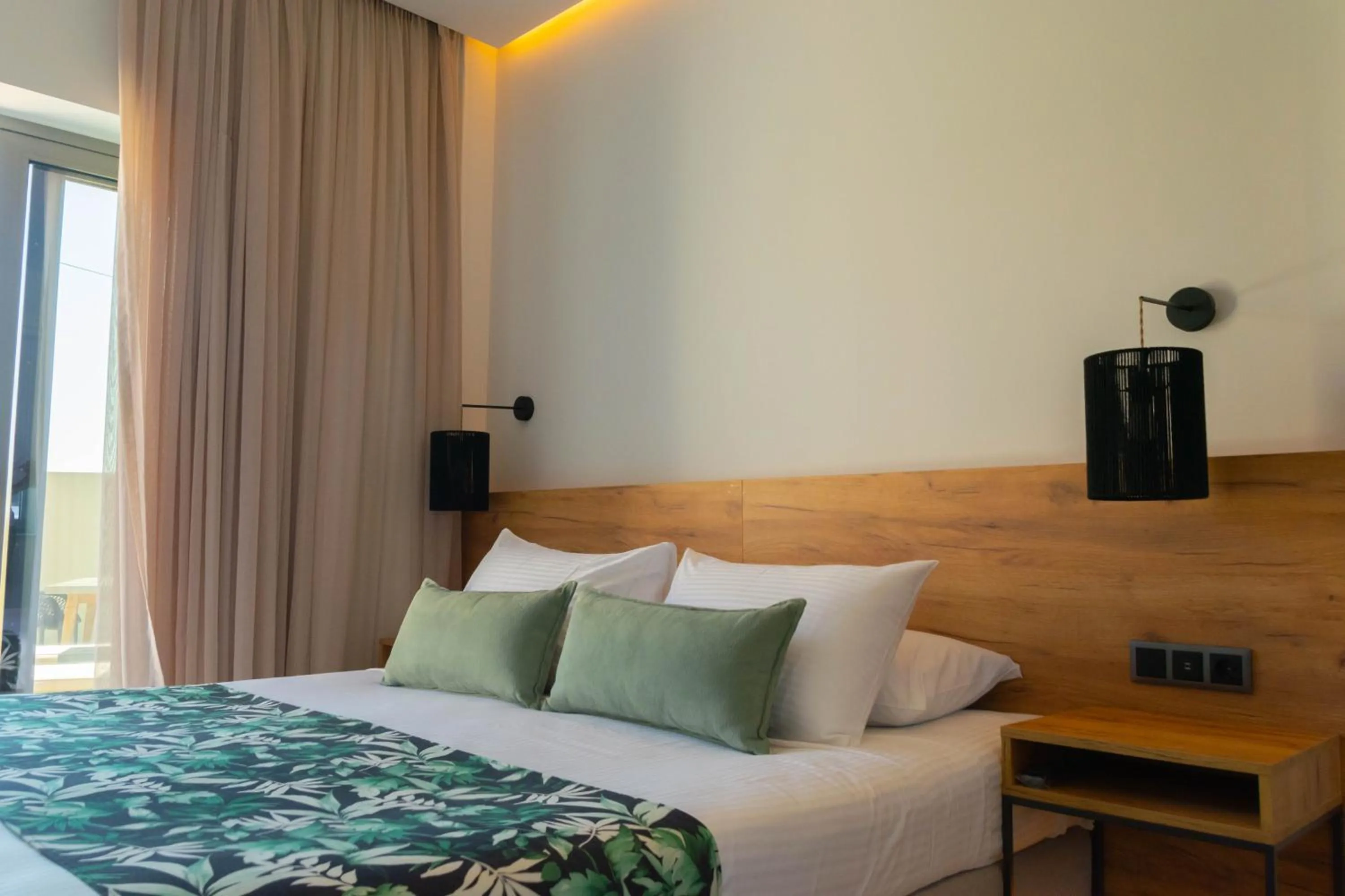 Bed in Kavos Hotel & Suites