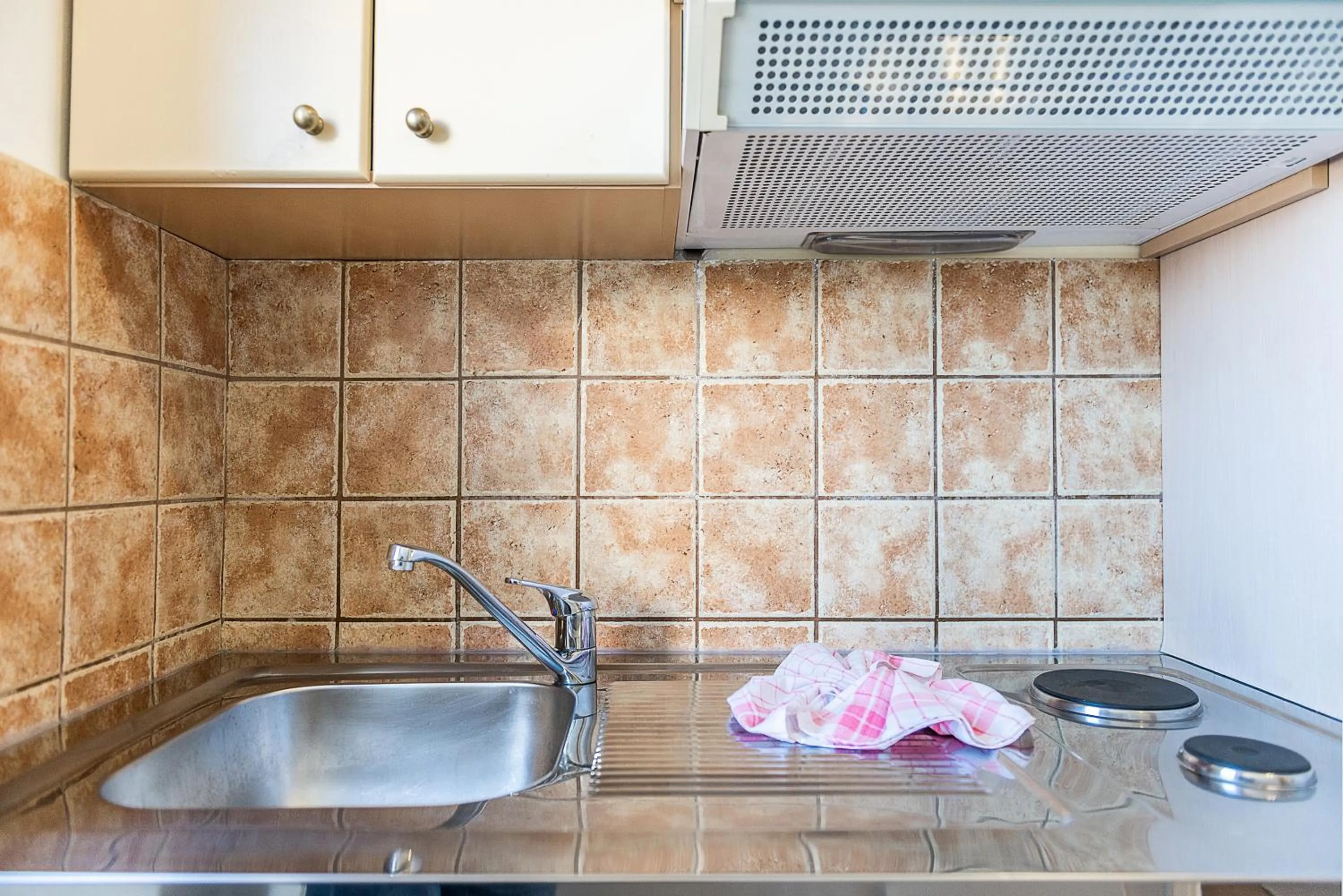 Kitchen or kitchenette in Kavos Hotel & Suites