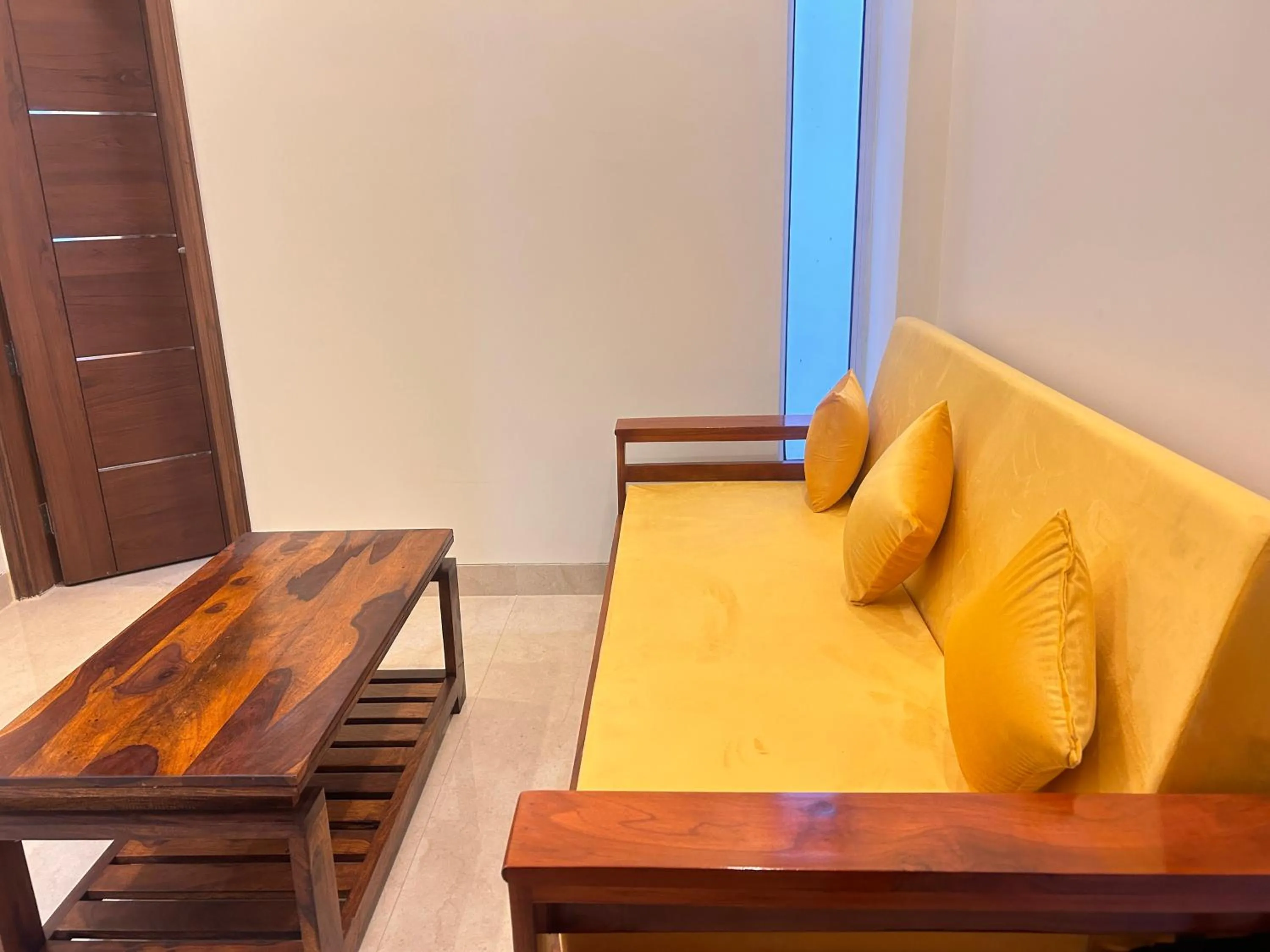Living room in Lime Tree 1BHK Serviced Apartment - Medanta Medicity, Gurgaon