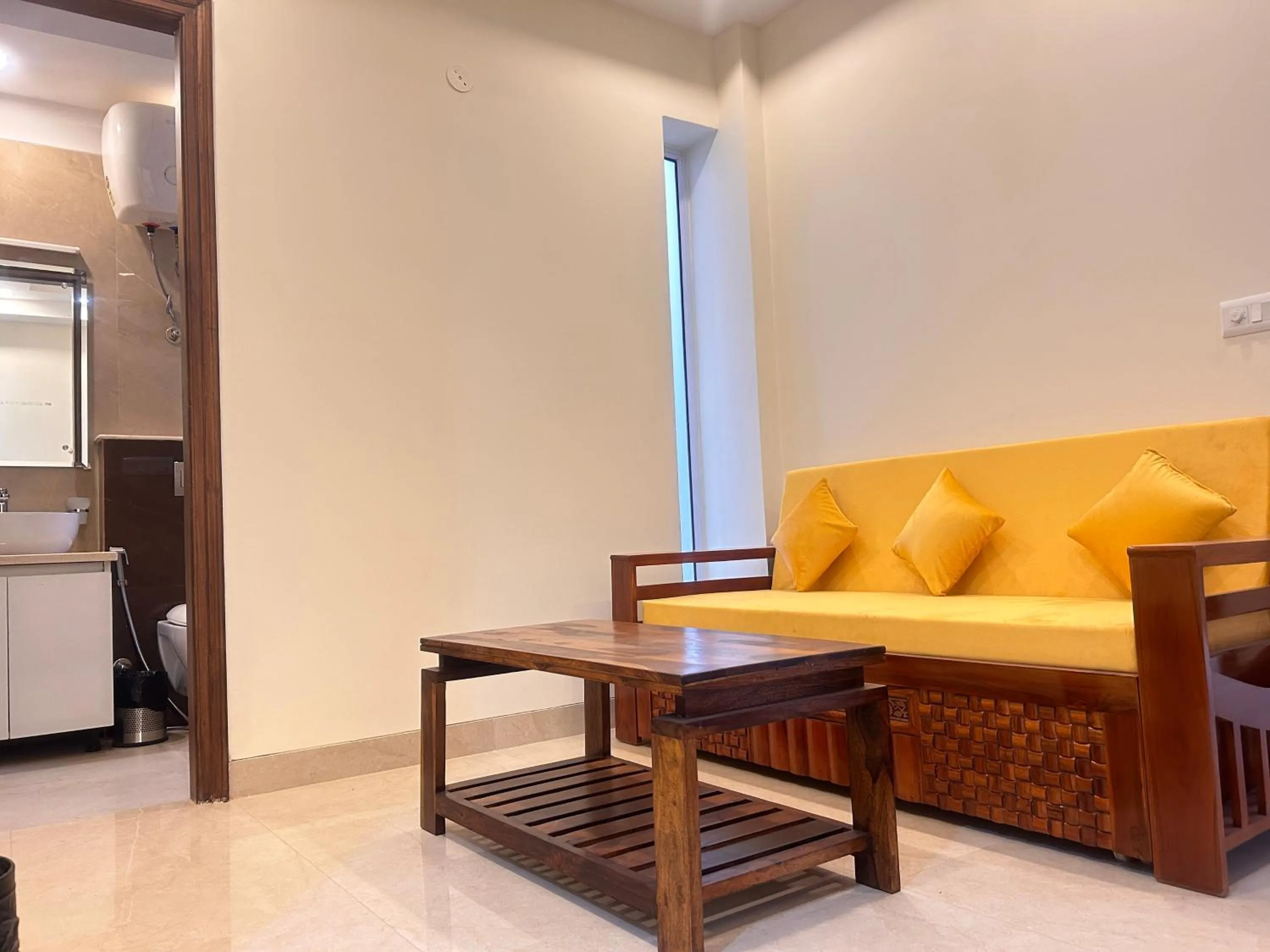Living room in Lime Tree 1BHK Serviced Apartment - Medanta Medicity, Gurgaon