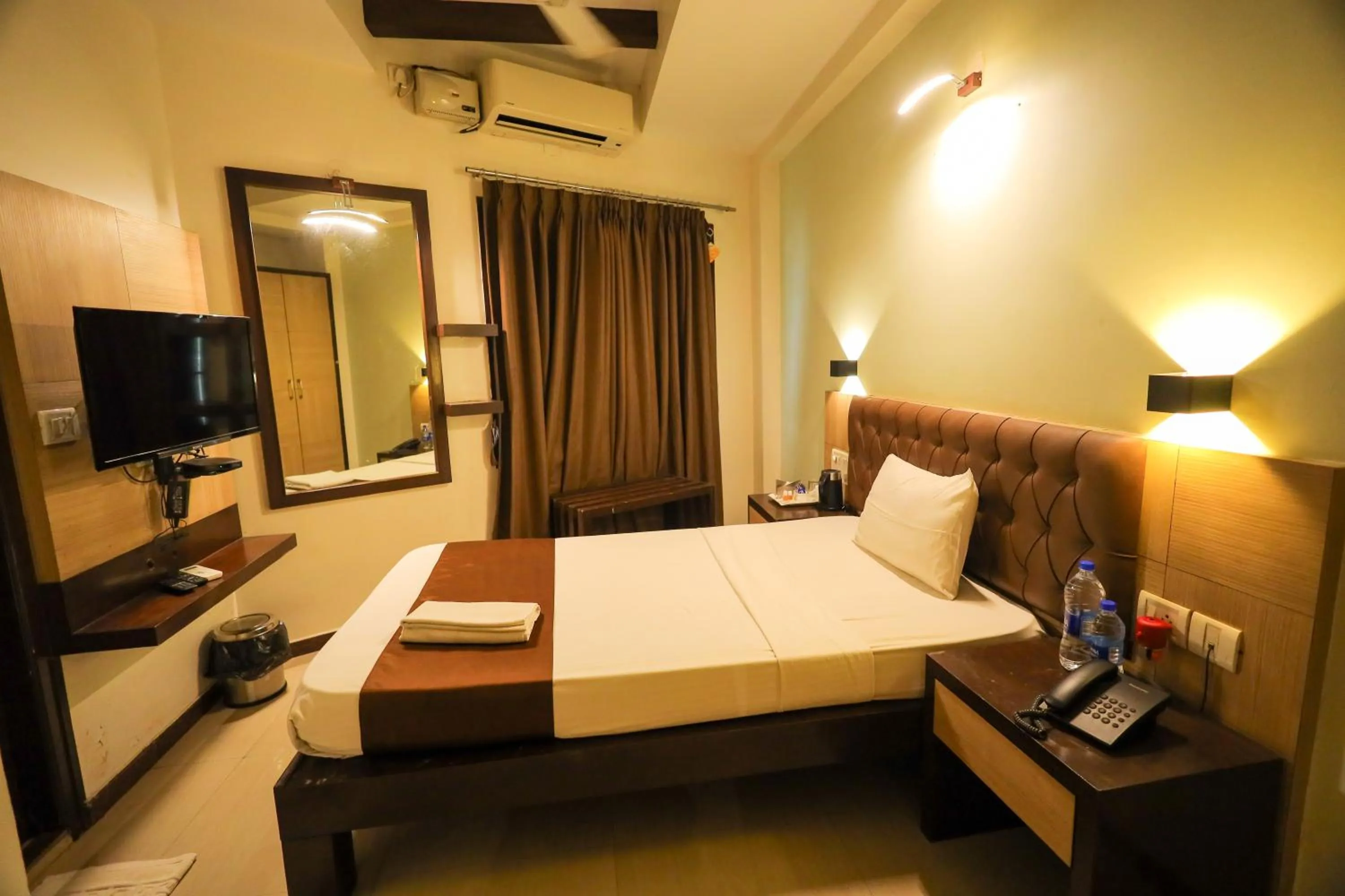 Bed in Hotel Plaza Heights by RAK Rooms, Mangaluru