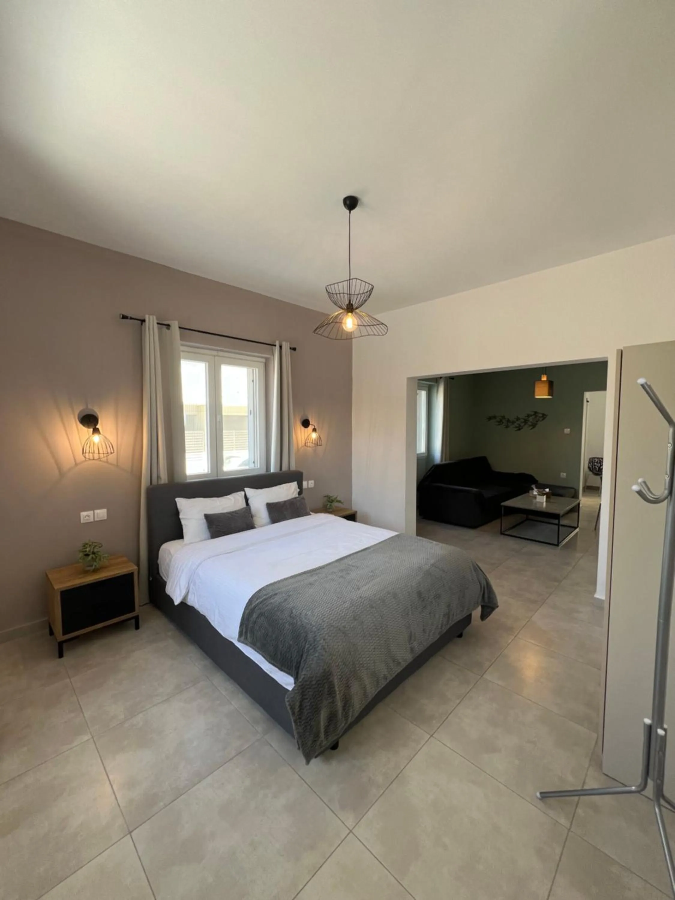 Bed in Elefsinian Mysteries Apartments