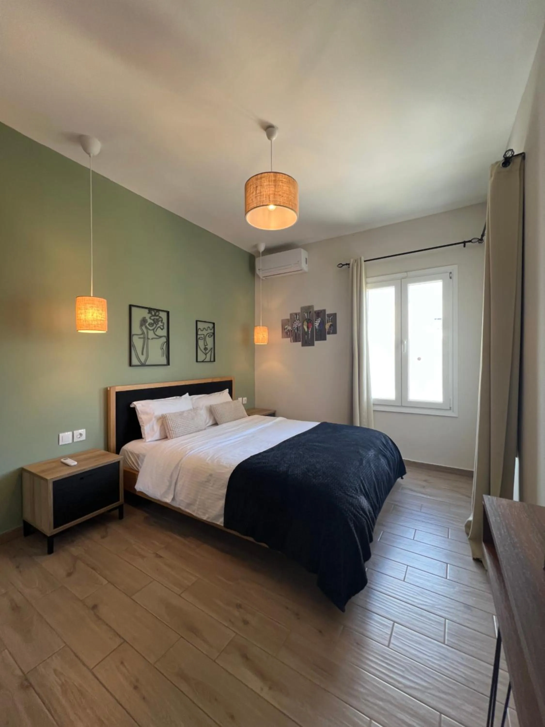 Bed in Elefsinian Mysteries Apartments