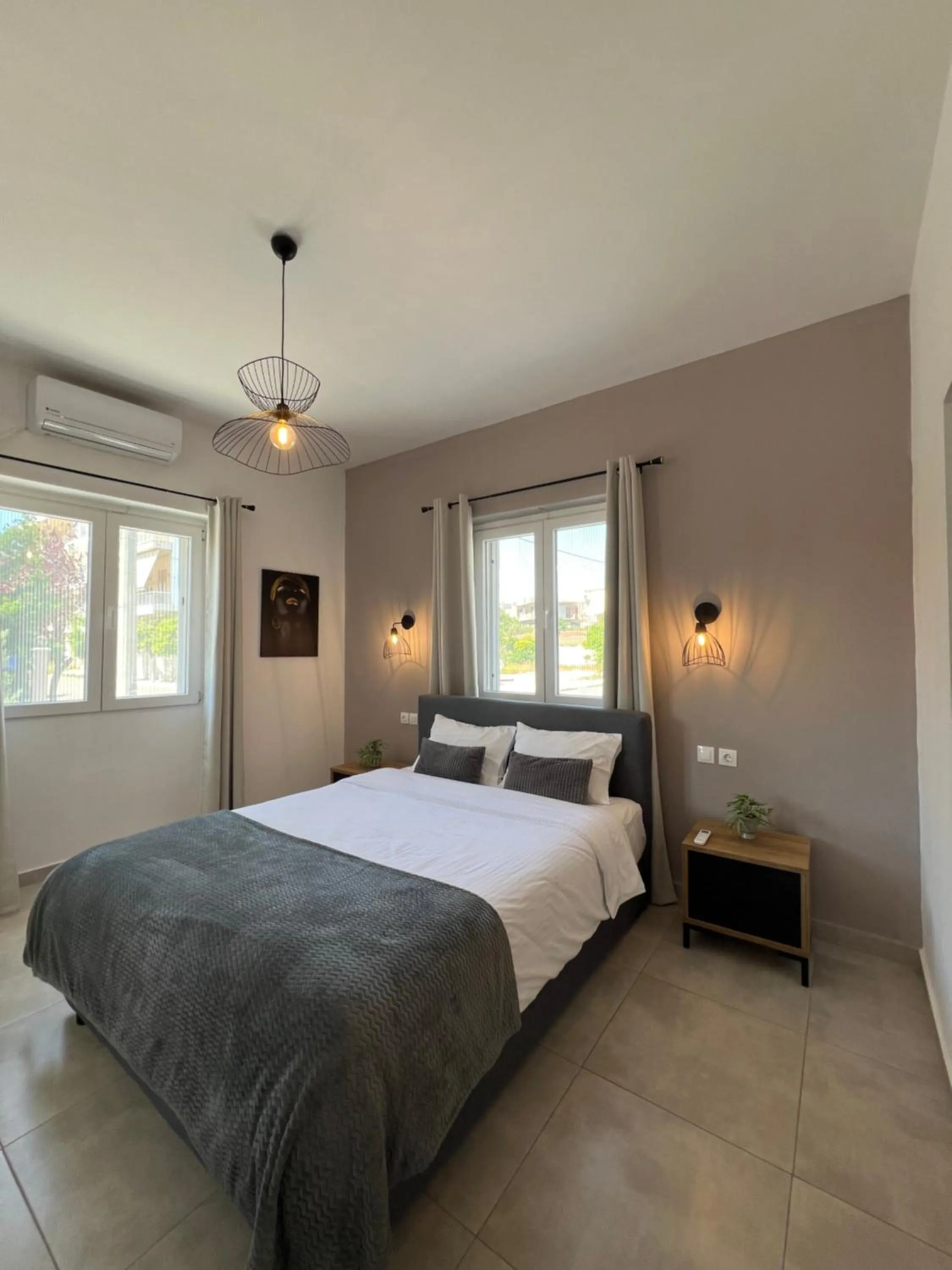 Bed in Elefsinian Mysteries Apartments