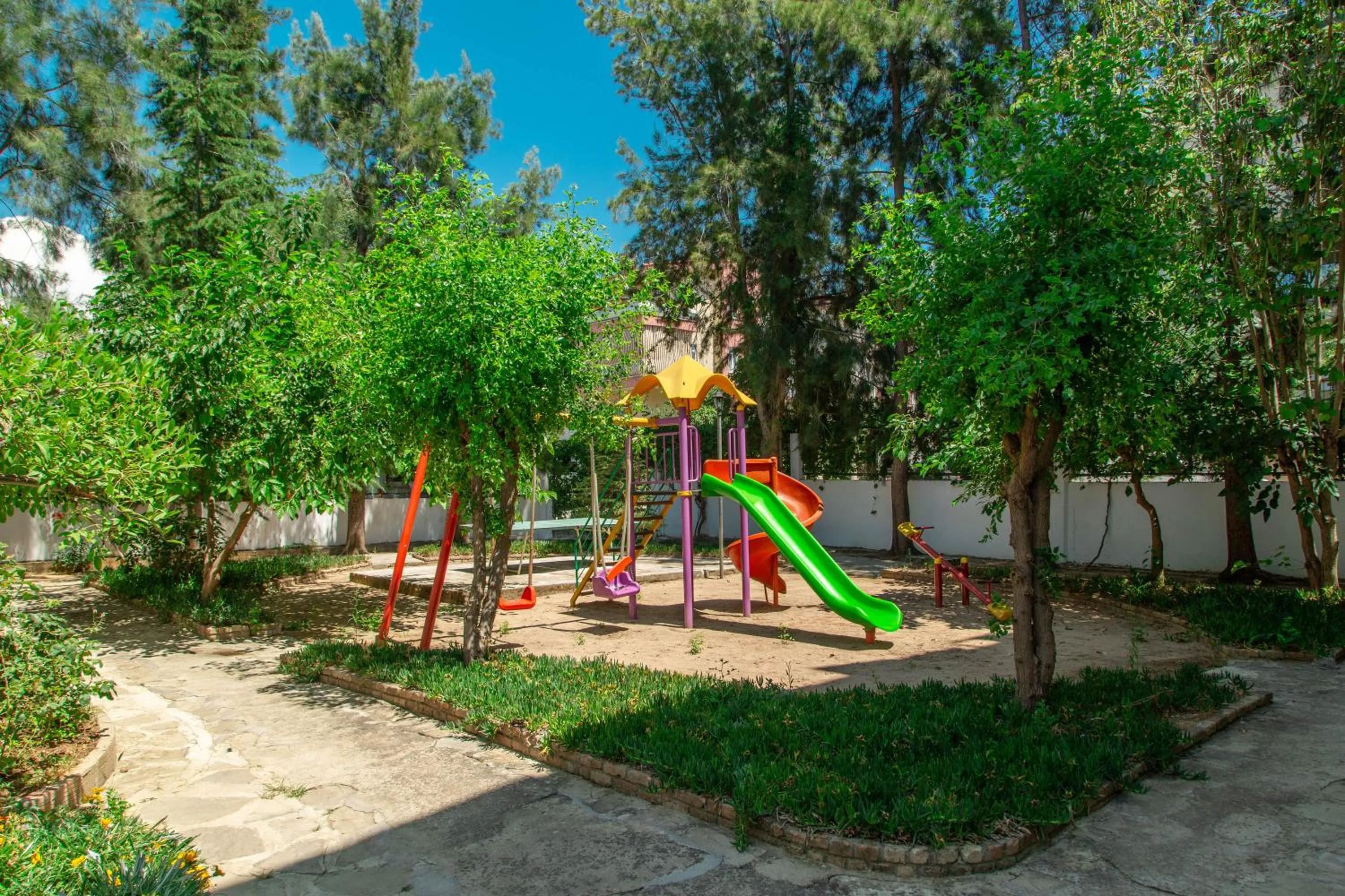 Children play ground in LEMAS SUITE HOTEL