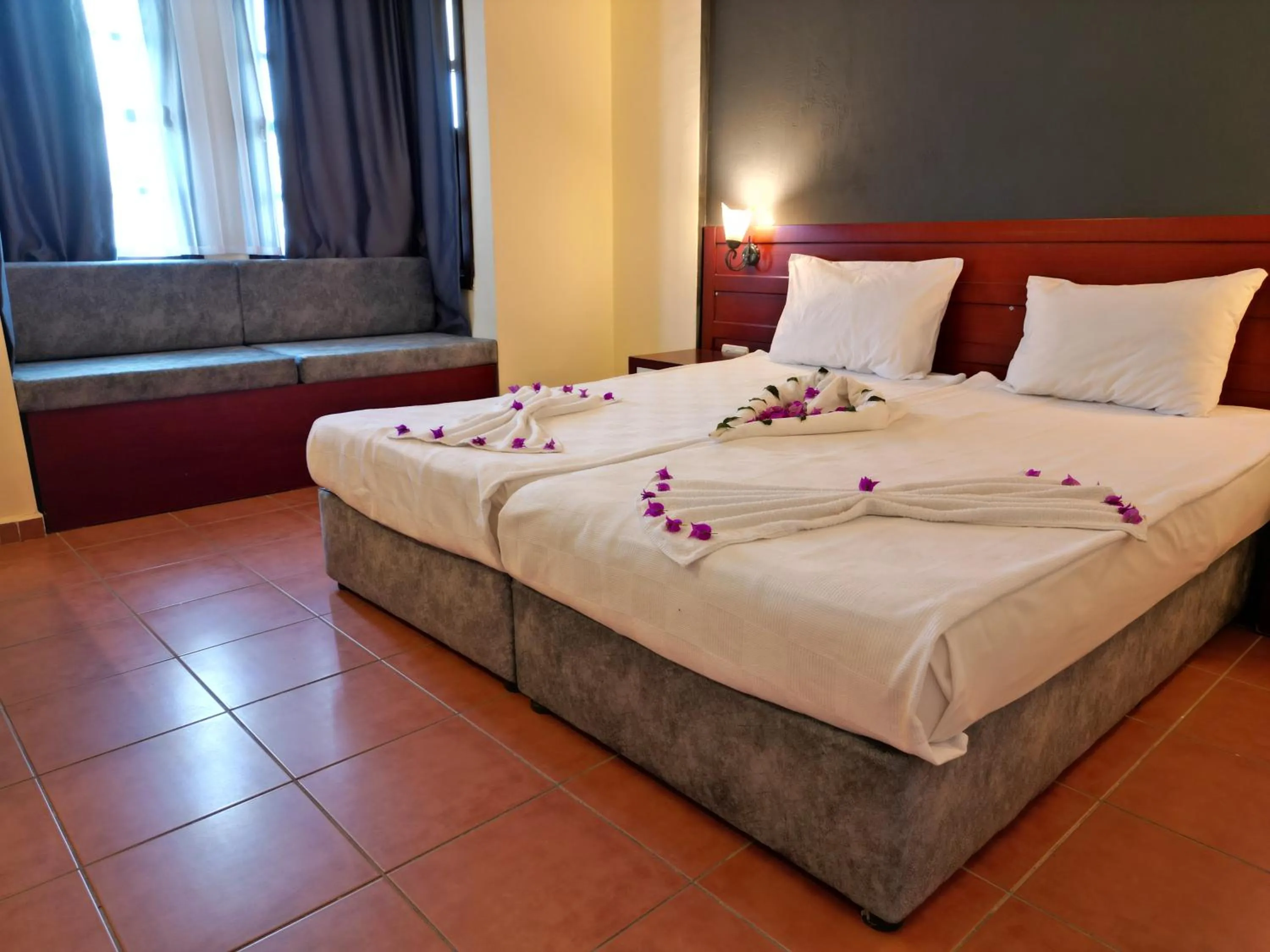 Bed in LEMAS SUITE HOTEL