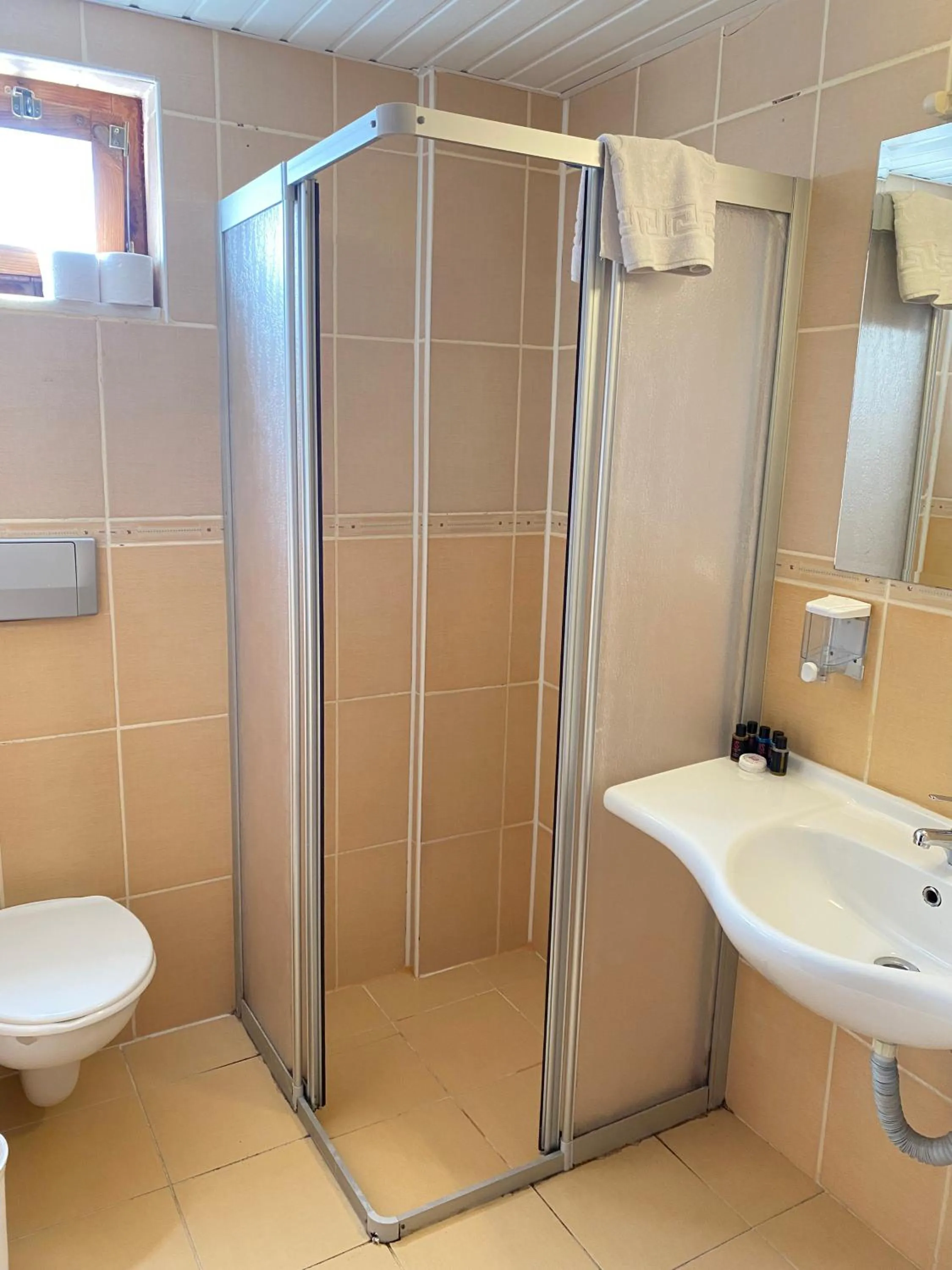 Bathroom in LEMAS SUITE HOTEL