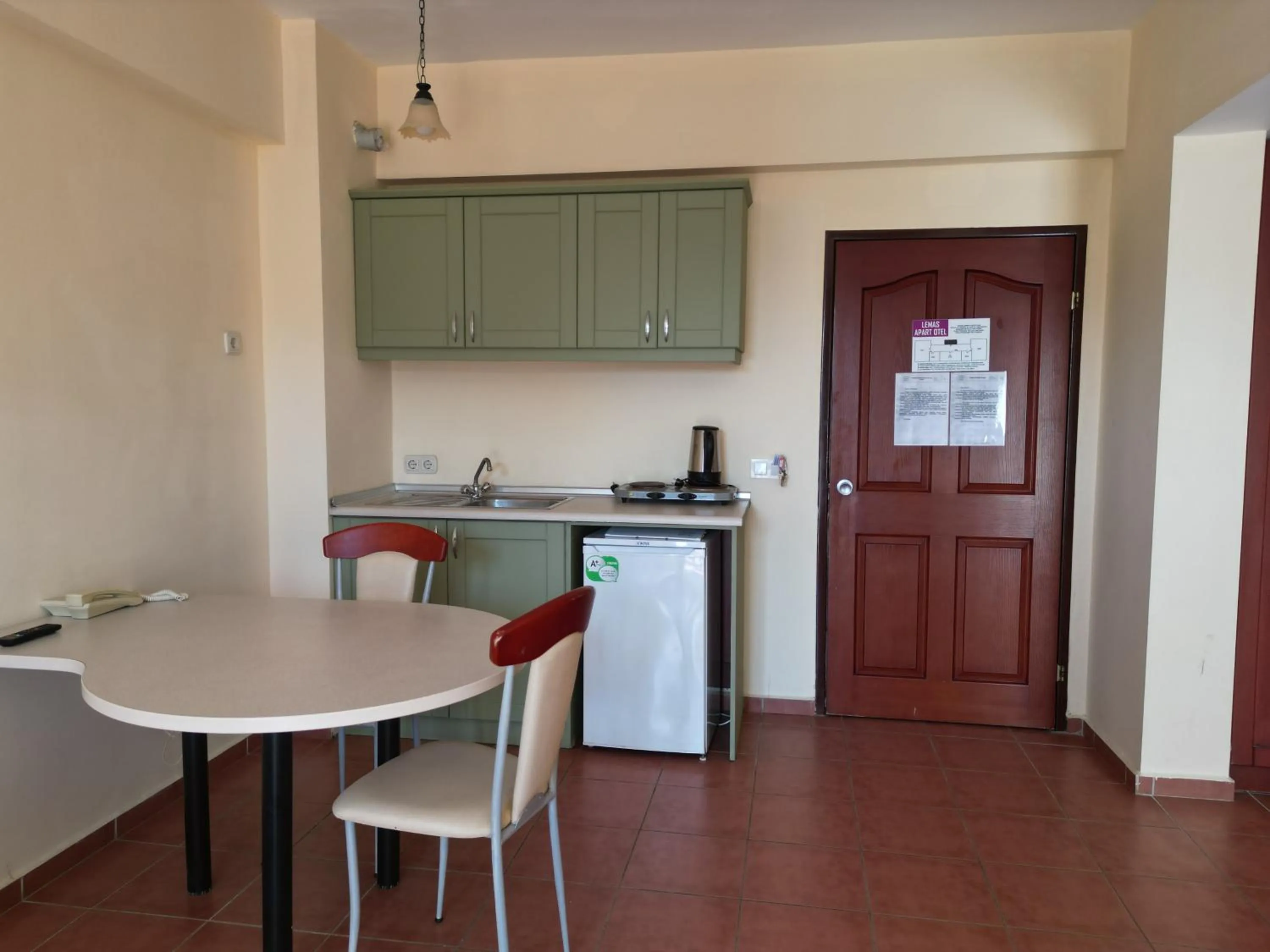 Kitchen or kitchenette in LEMAS SUITE HOTEL