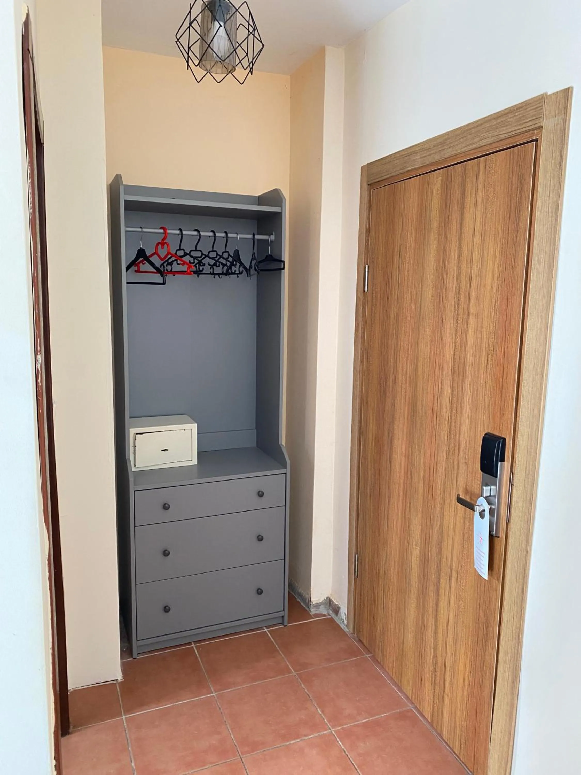 wardrobe in LEMAS SUITE HOTEL