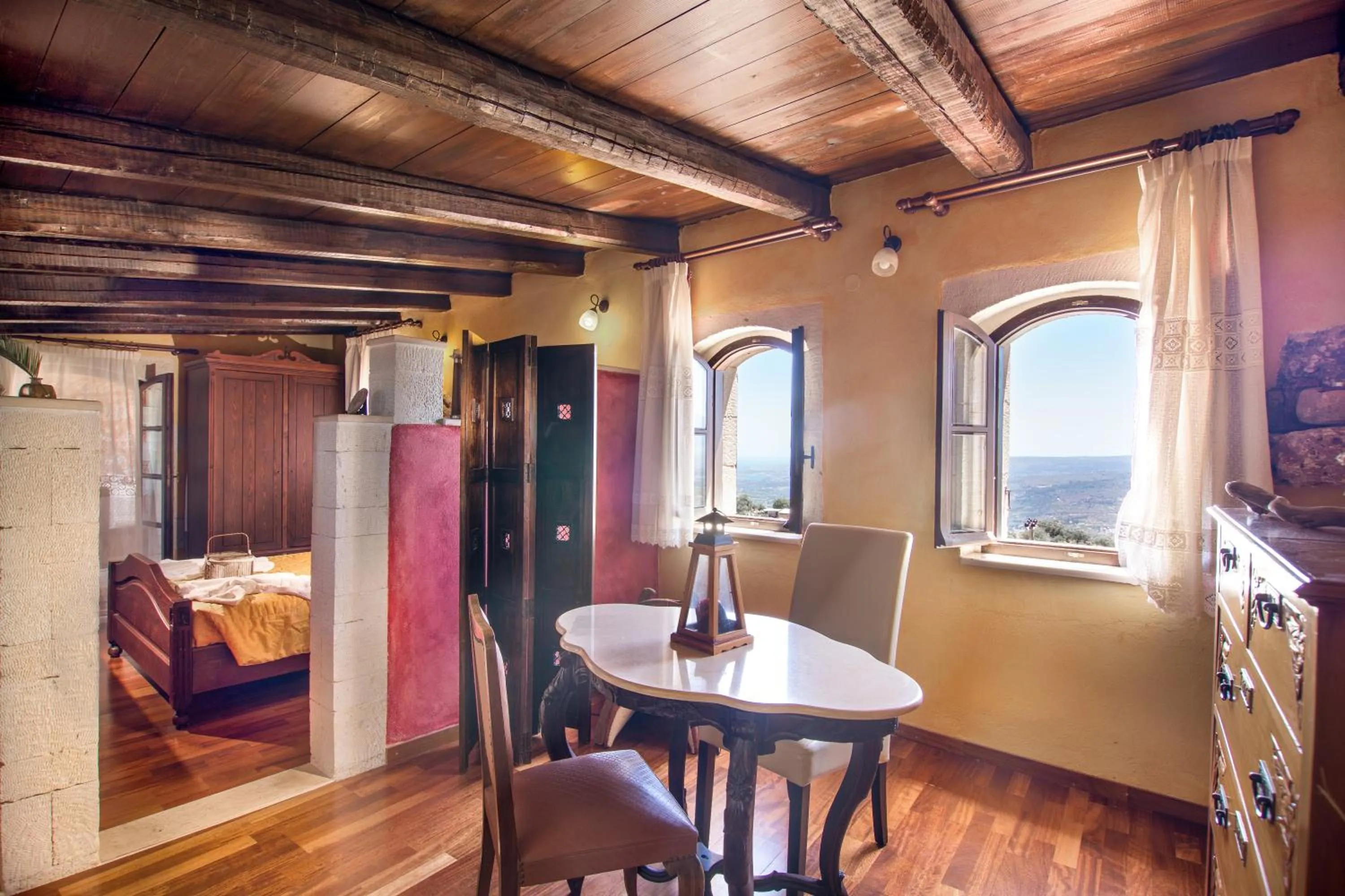 Seating area, Bed in Samonas Traditional Villas