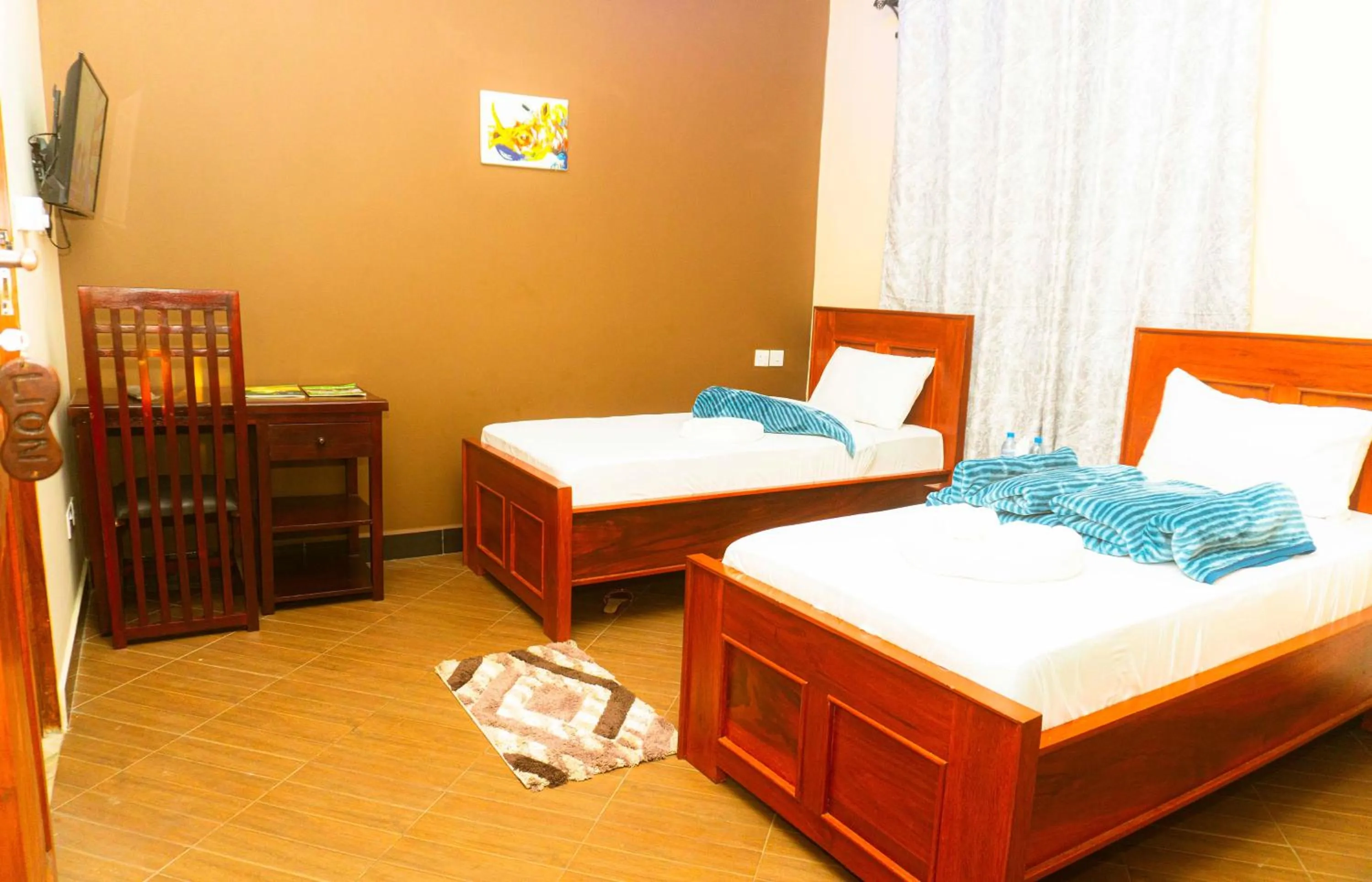 TV and multimedia, Bed in Kiteme Comfort Lodge