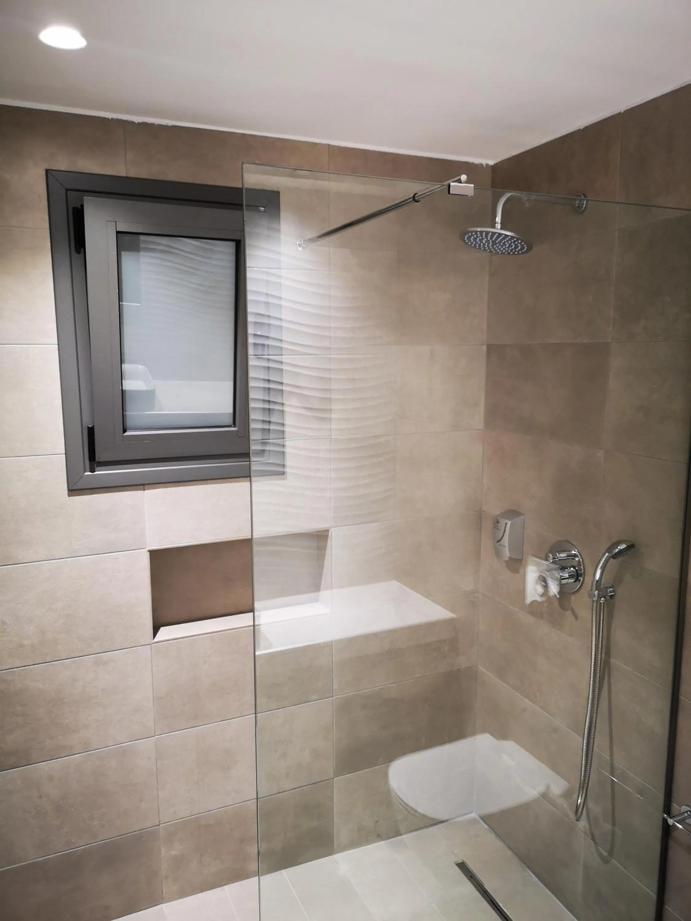 Bathroom in Zoes Hotel & Suites