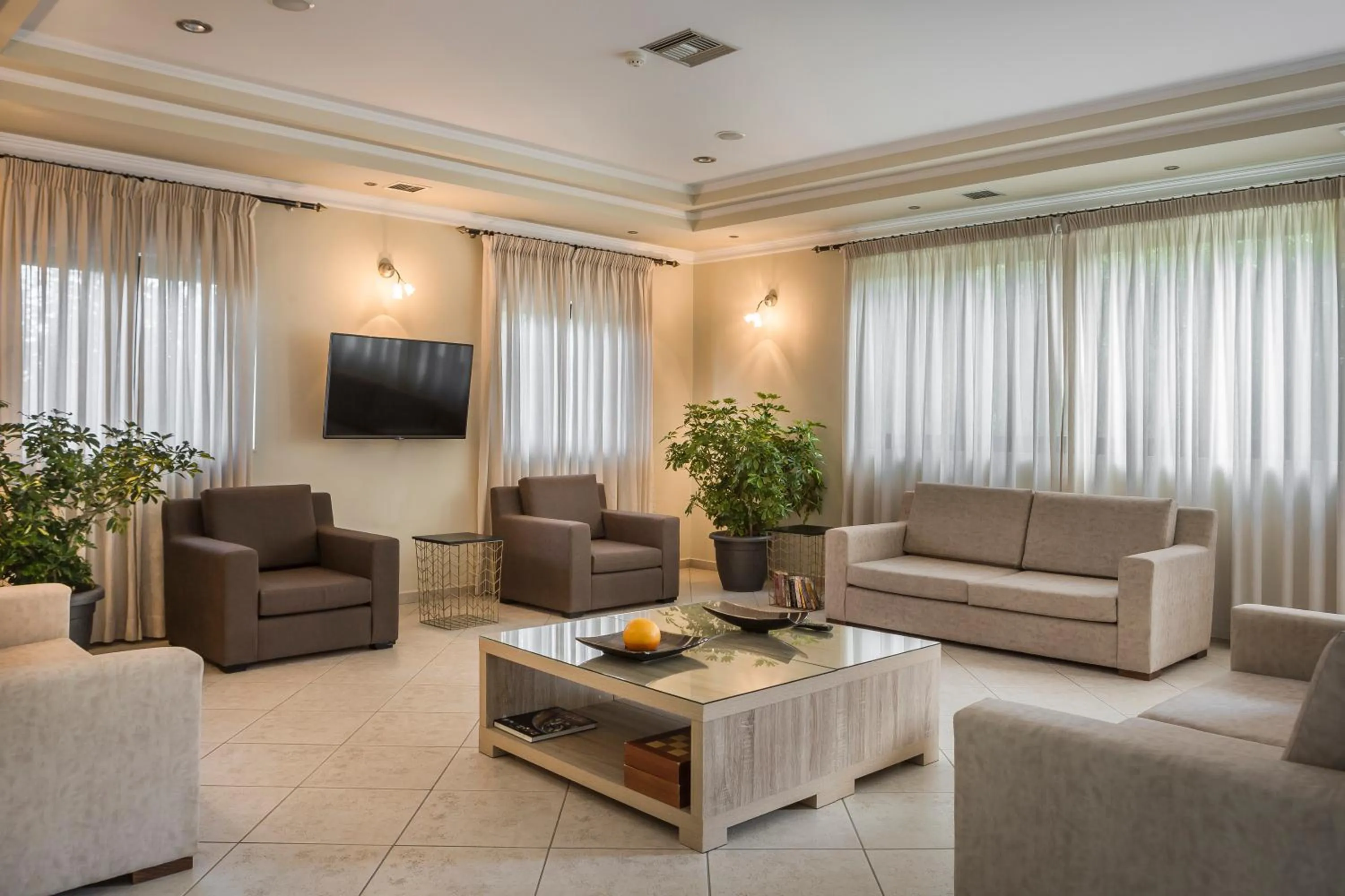 Communal lounge/ TV room in Limanaki Hotel