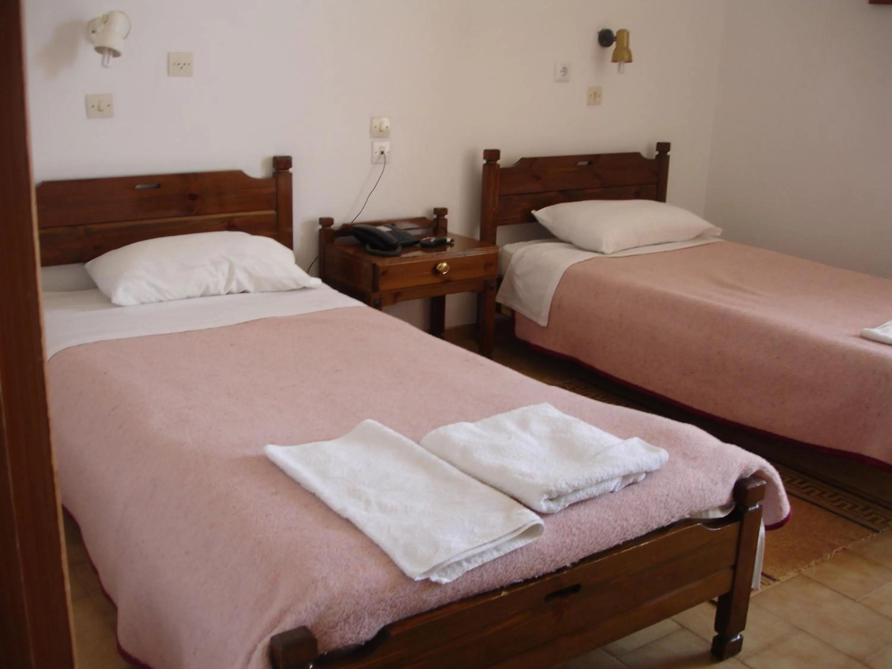 Bed in Hotel Inomaos