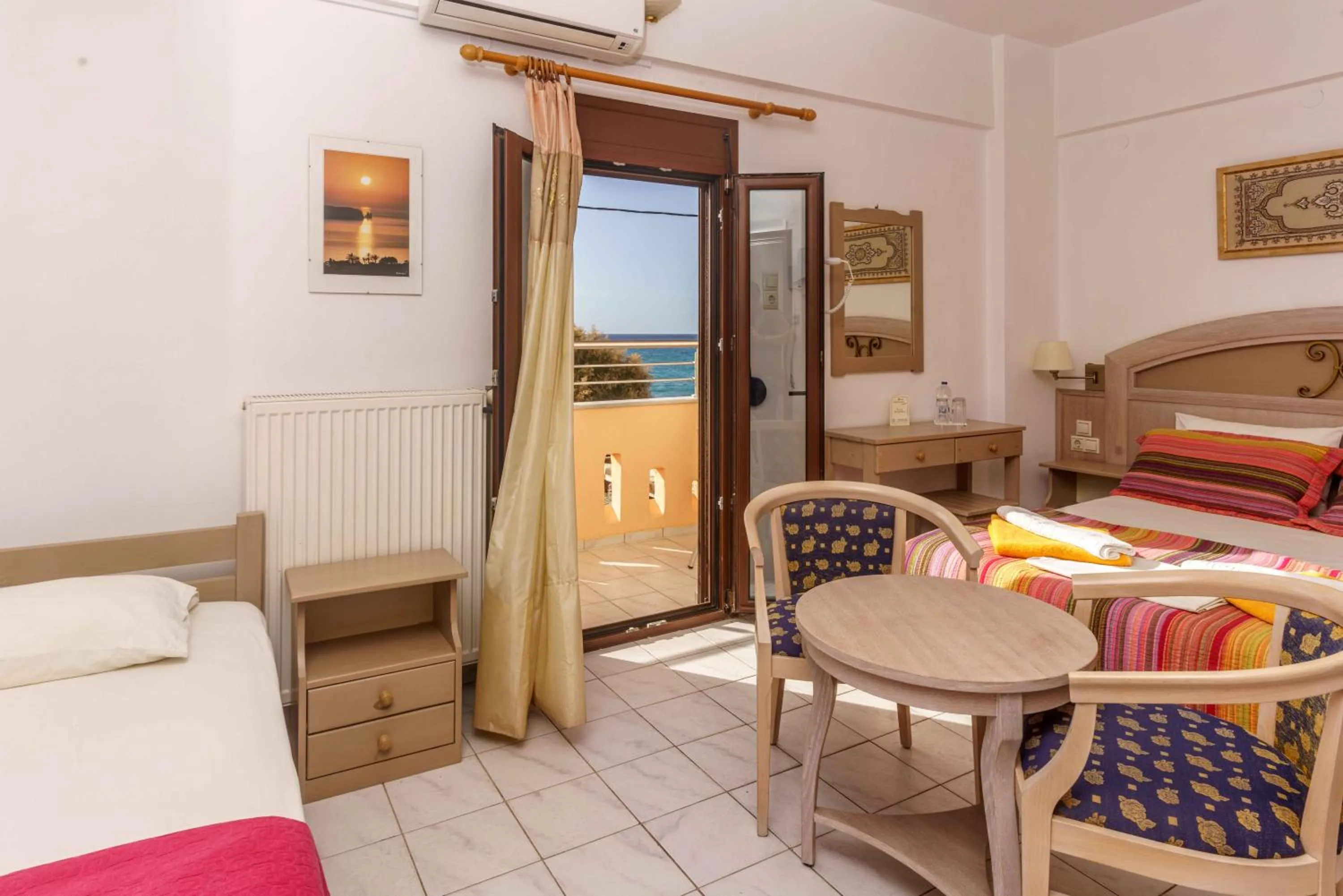 Seating area, Bed in Alexander Beach Hotel