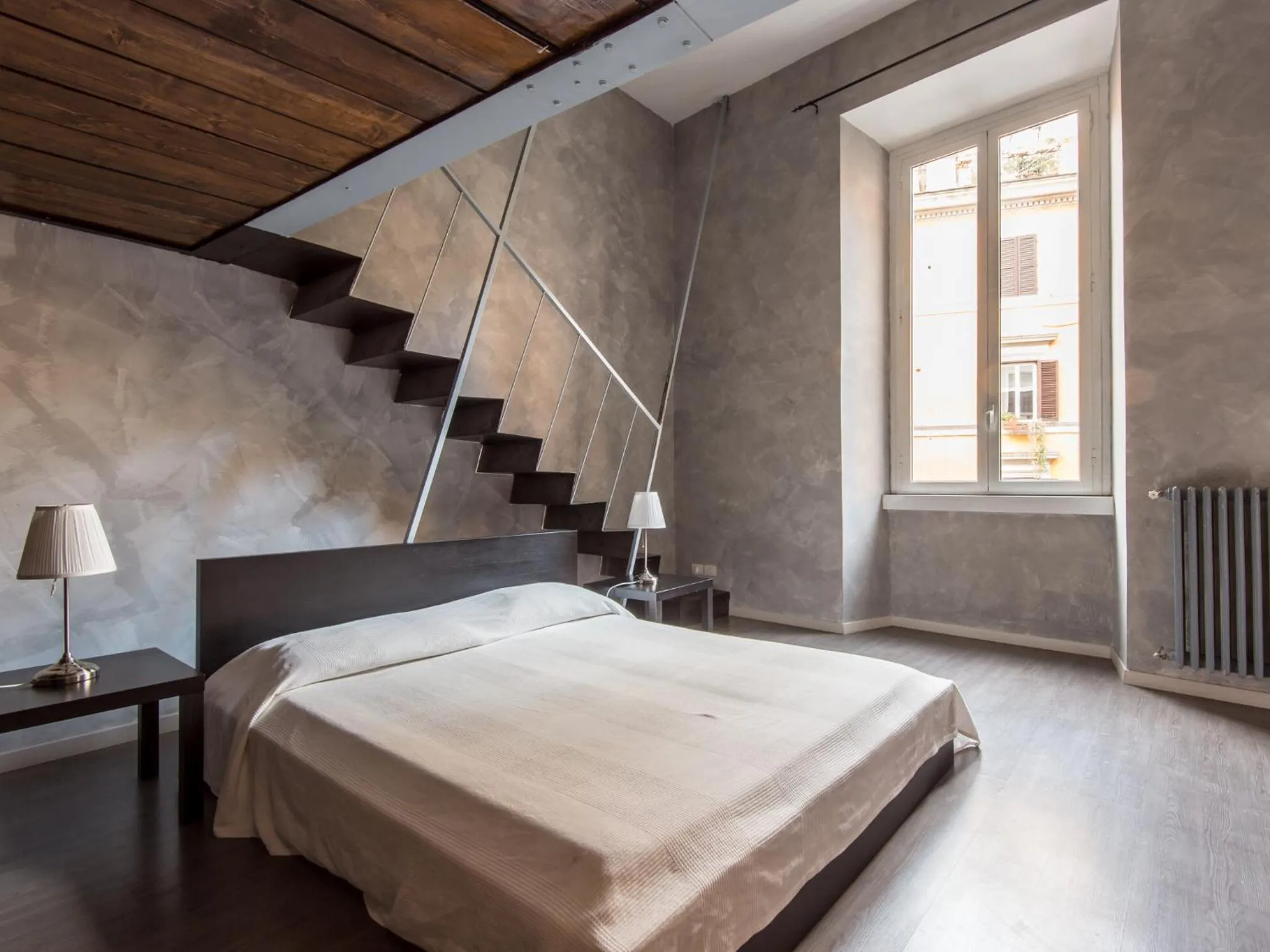 Bed in Ara Pacis Navona Apartments