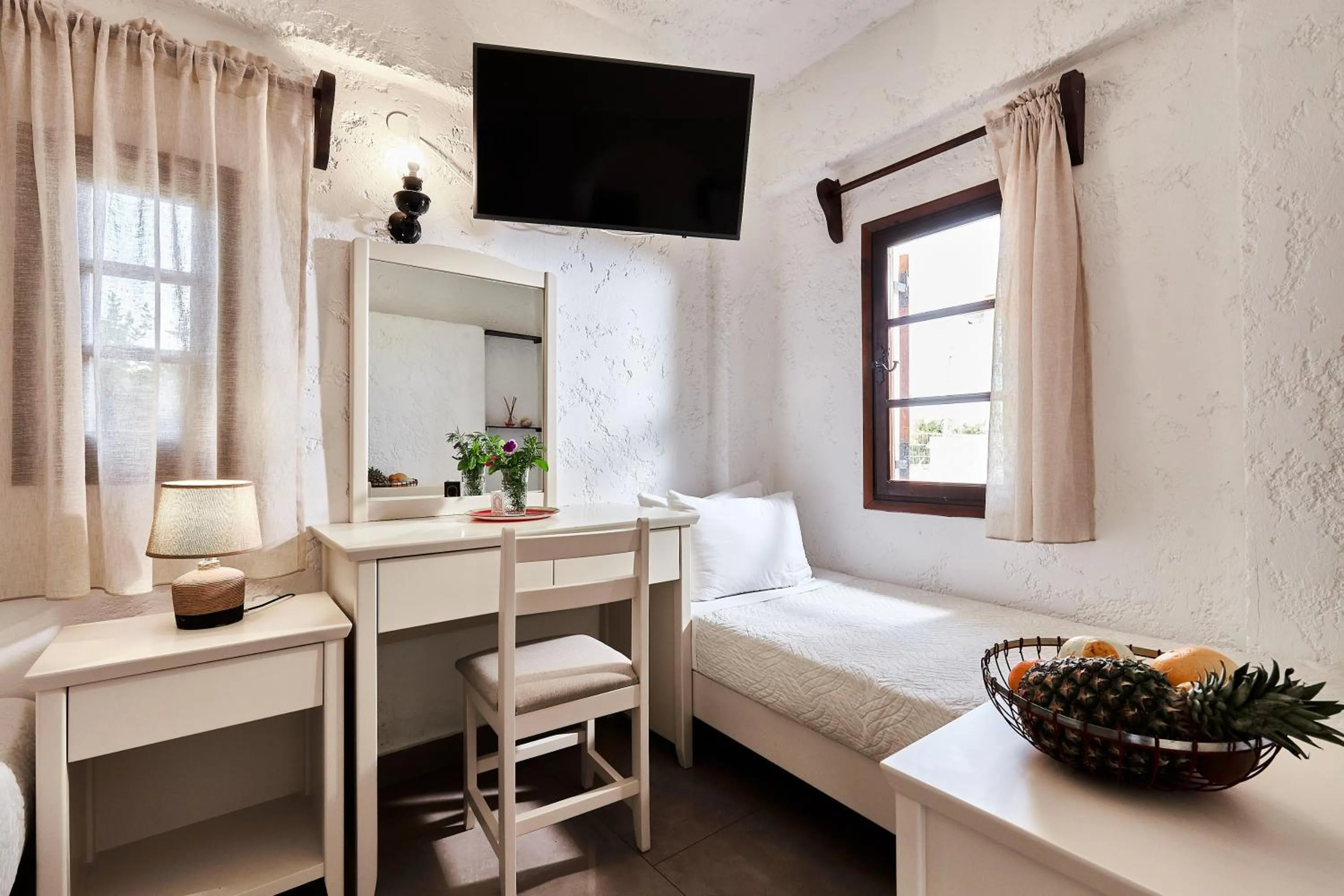 Bed in Mila Malia Studios Hotel