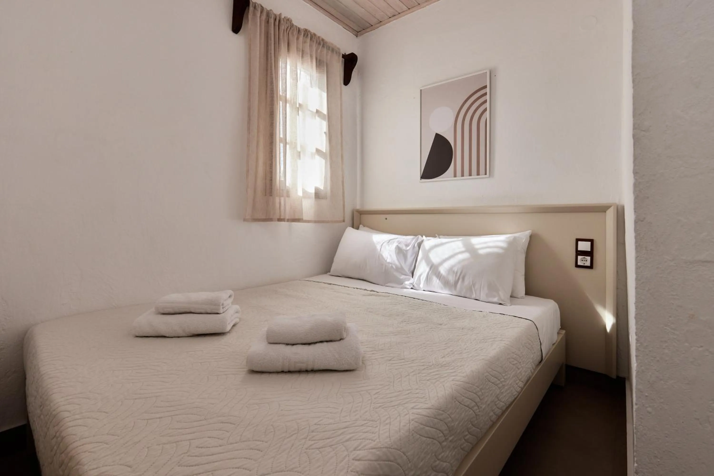 Bed in Mila Malia Studios Hotel