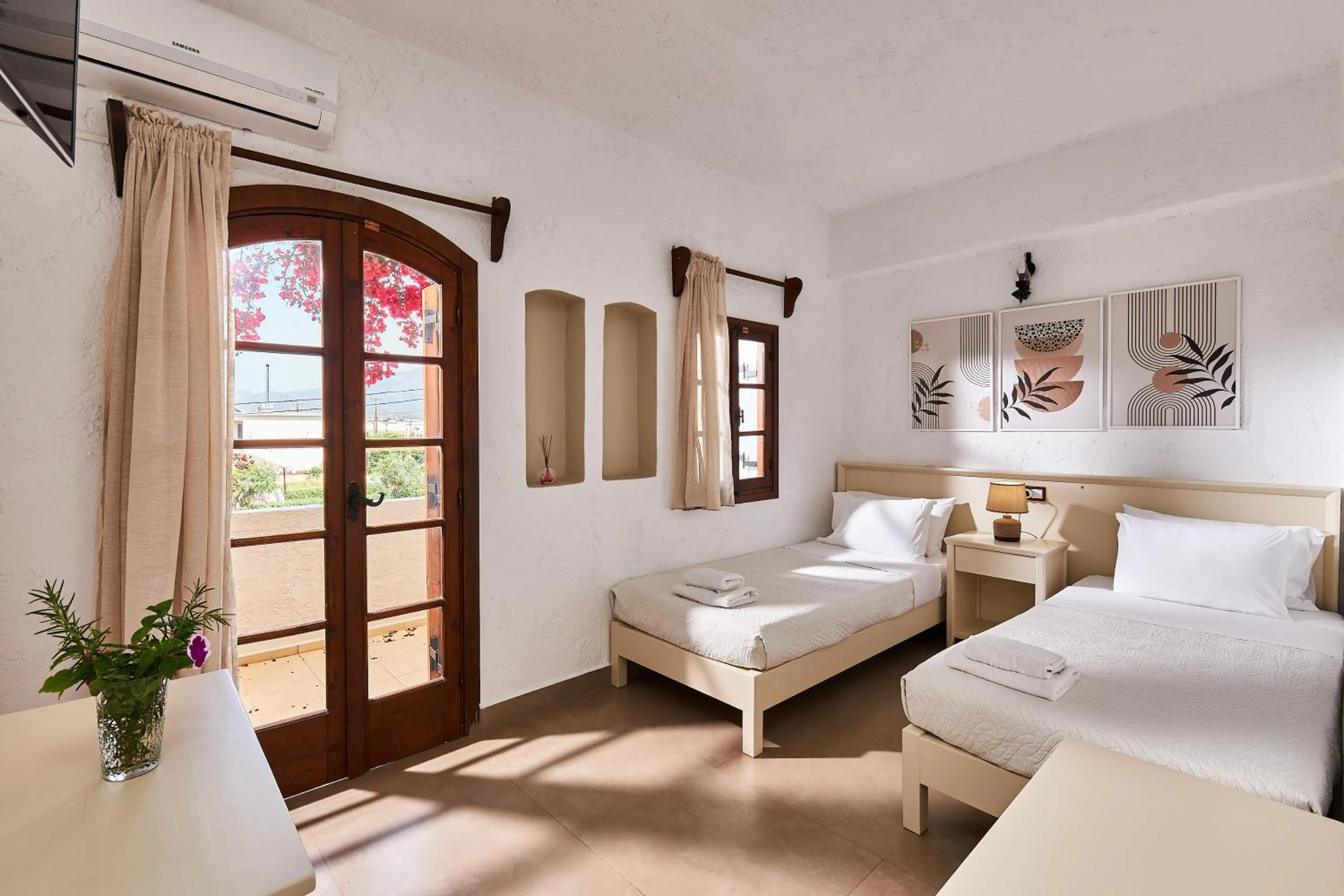 Bed in Mila Malia Studios Hotel