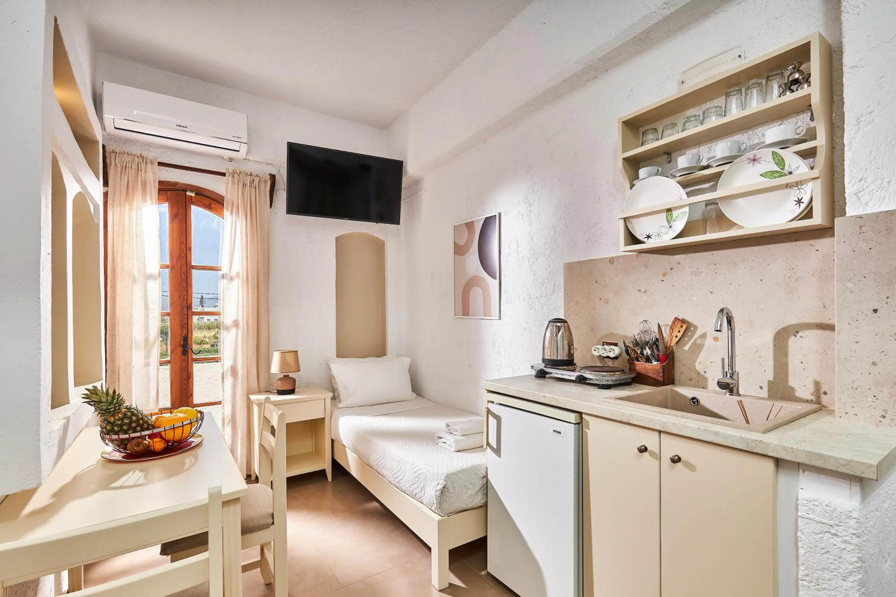 Bed in Mila Malia Studios Hotel