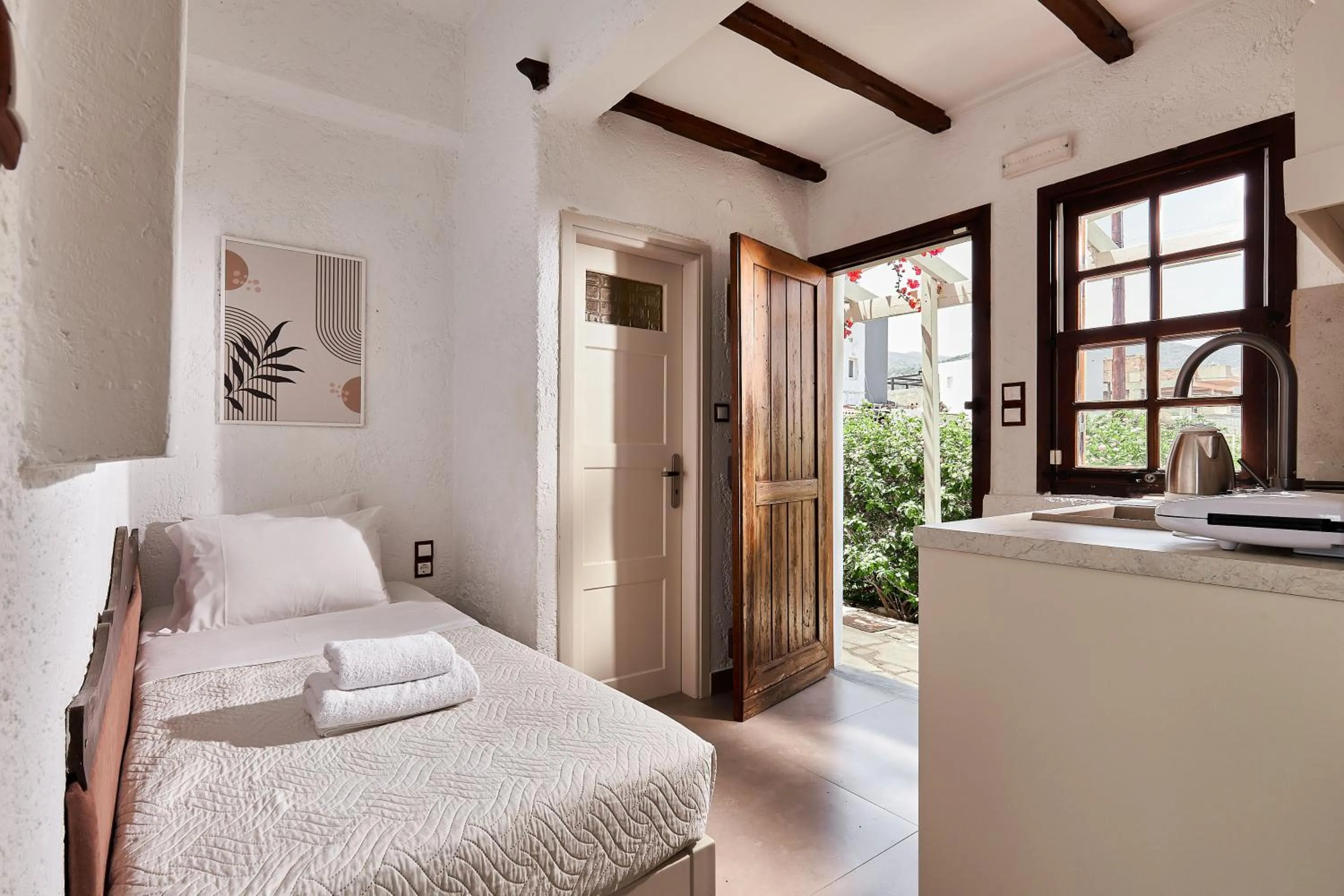 Bed in Mila Malia Studios Hotel