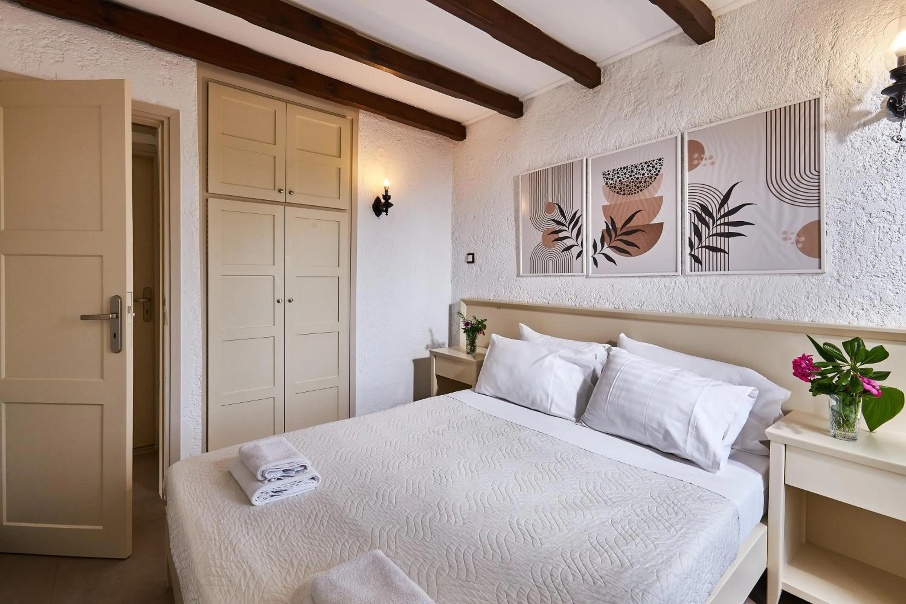 Bed in Mila Malia Studios Hotel