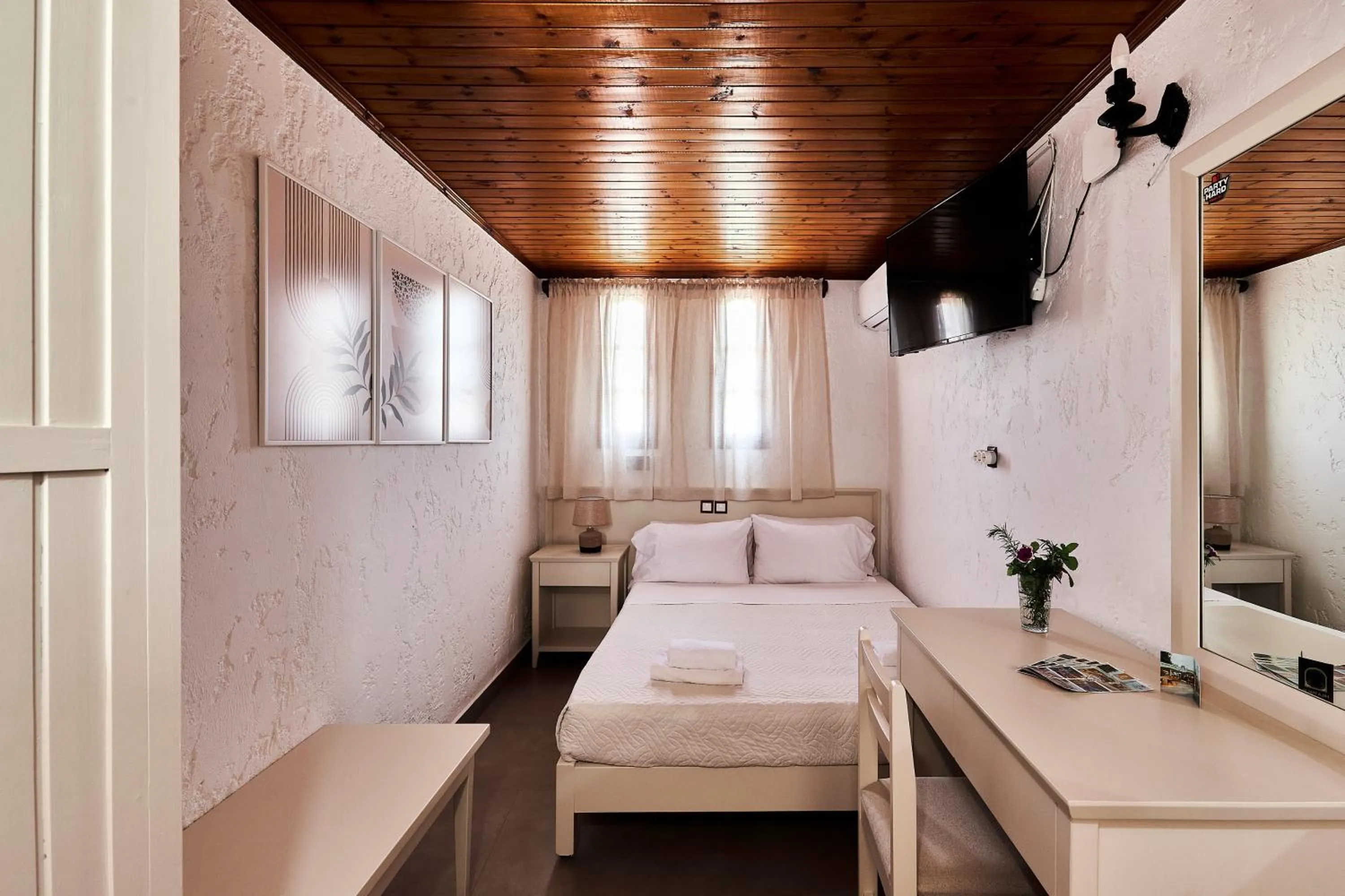 Bed in Mila Malia Studios Hotel