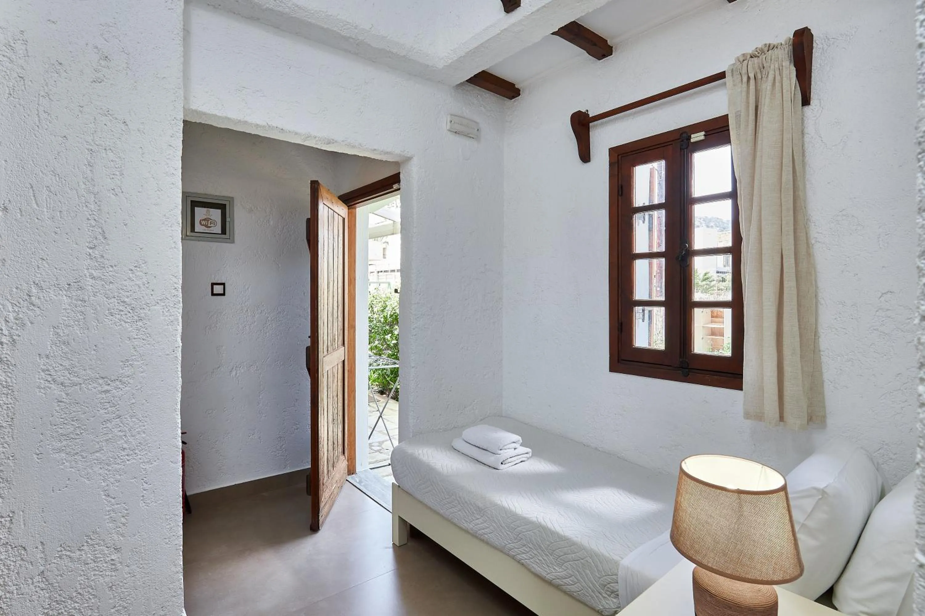 Bed in Mila Malia Studios Hotel