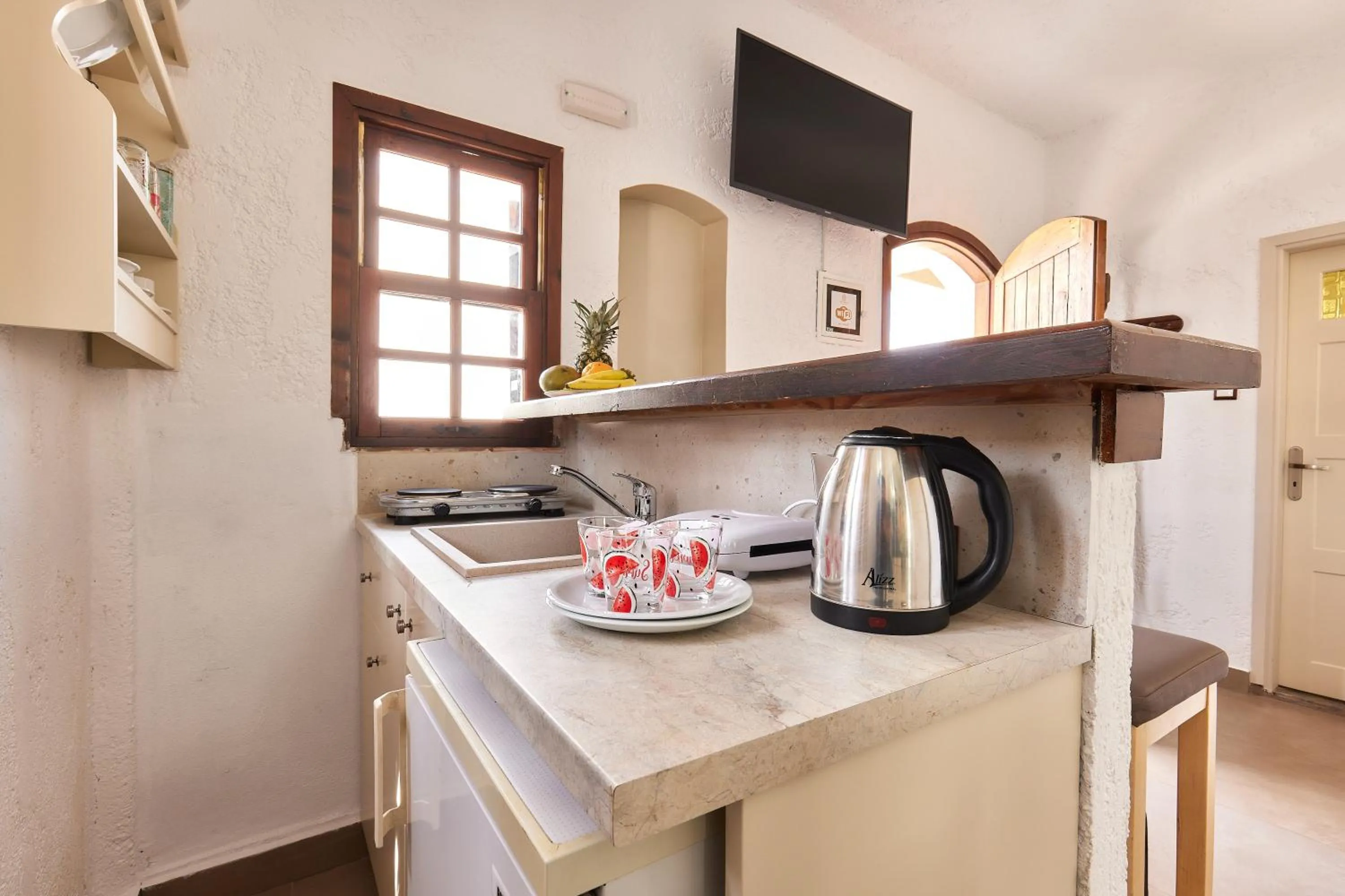 kitchen in Mila Malia Studios Hotel