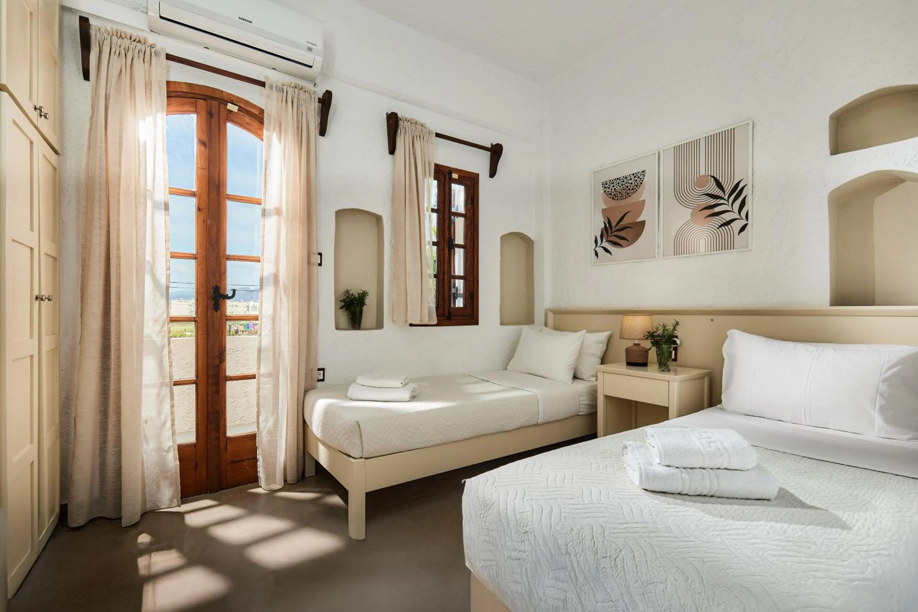 Bed in Mila Malia Studios Hotel